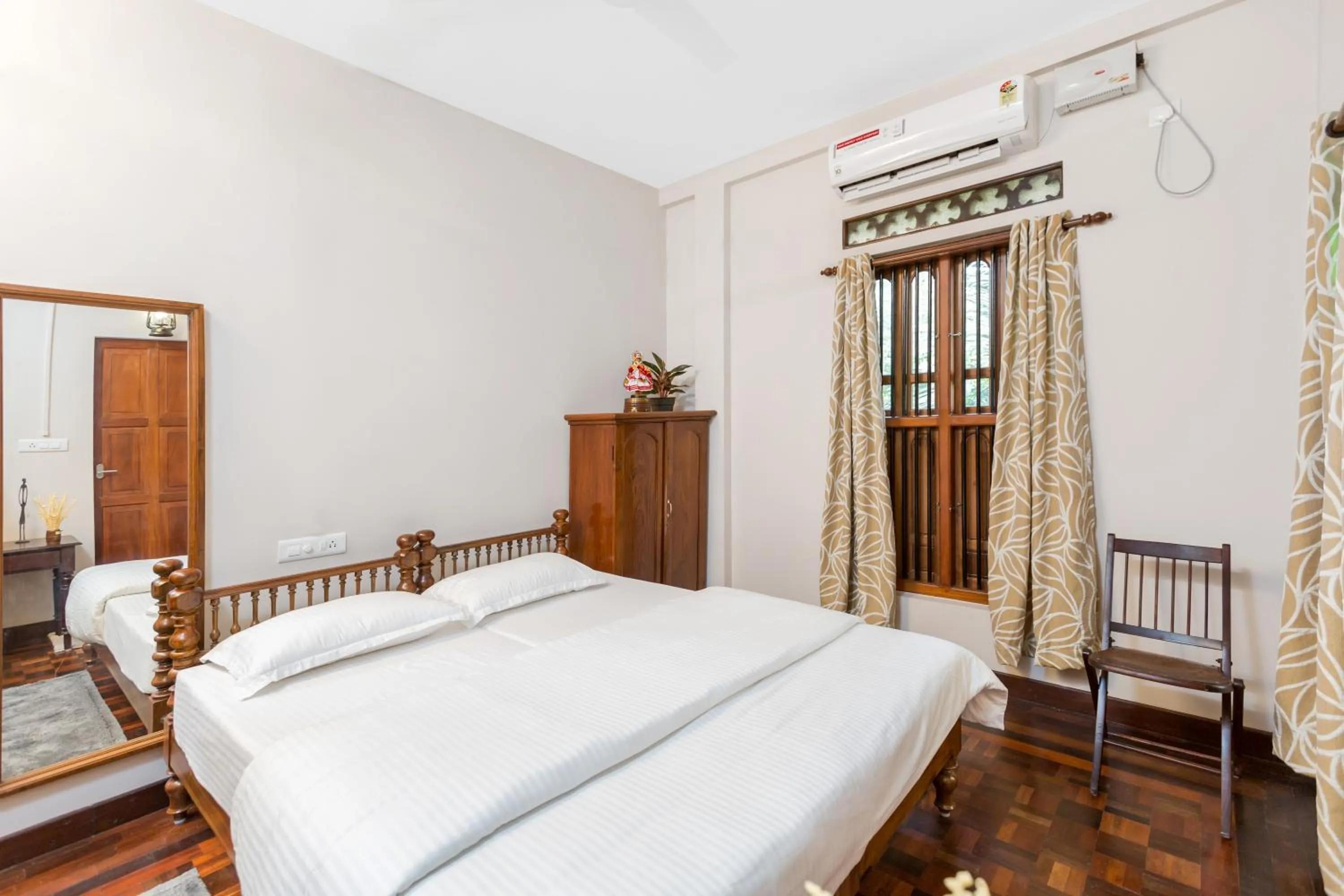 Bed in Kumarakom Wood Castle Serviced Appartments