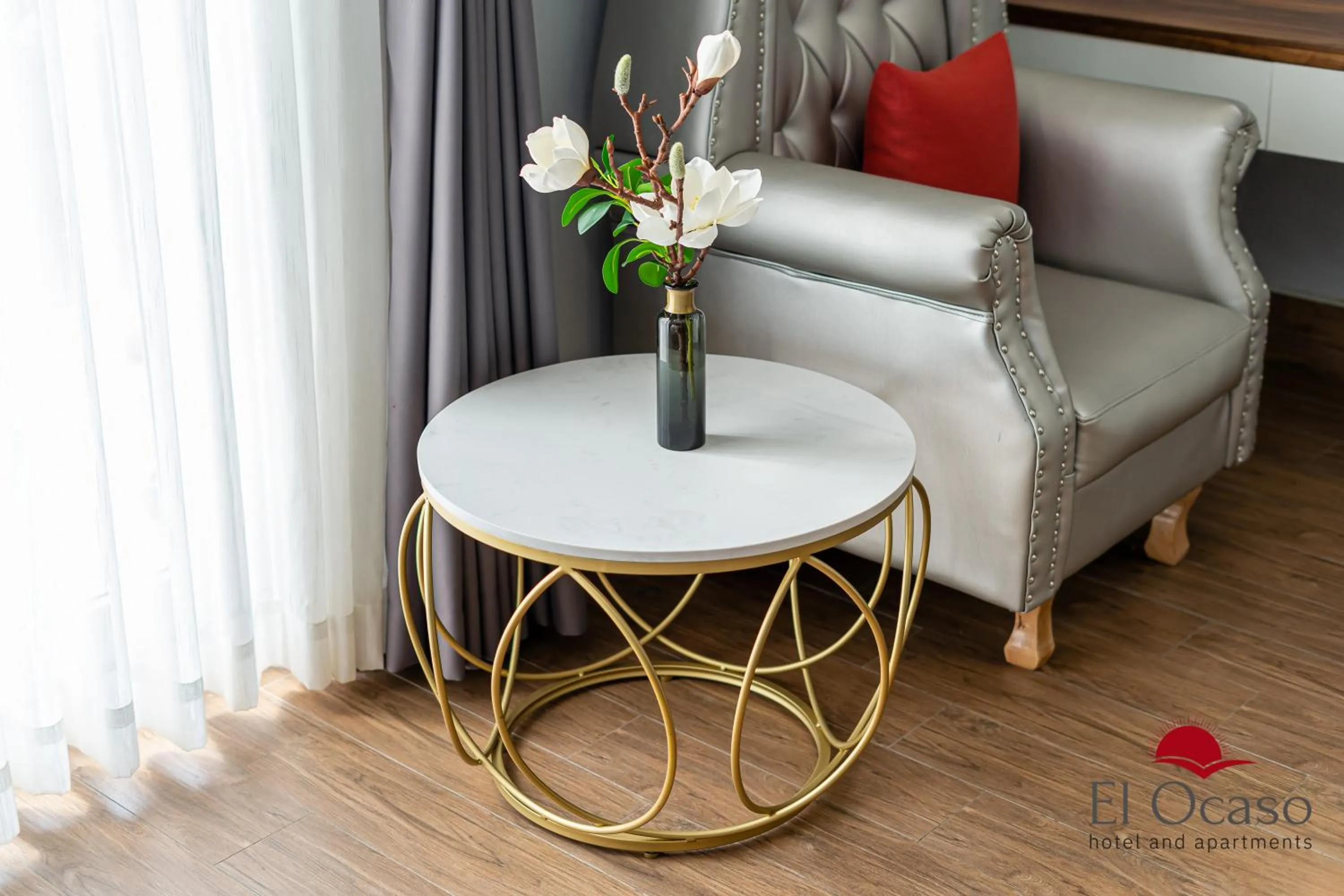 Seating area, Bed in El Ocaso Hotel and Apartments