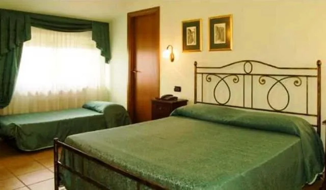 Bed in Dominus Hotel