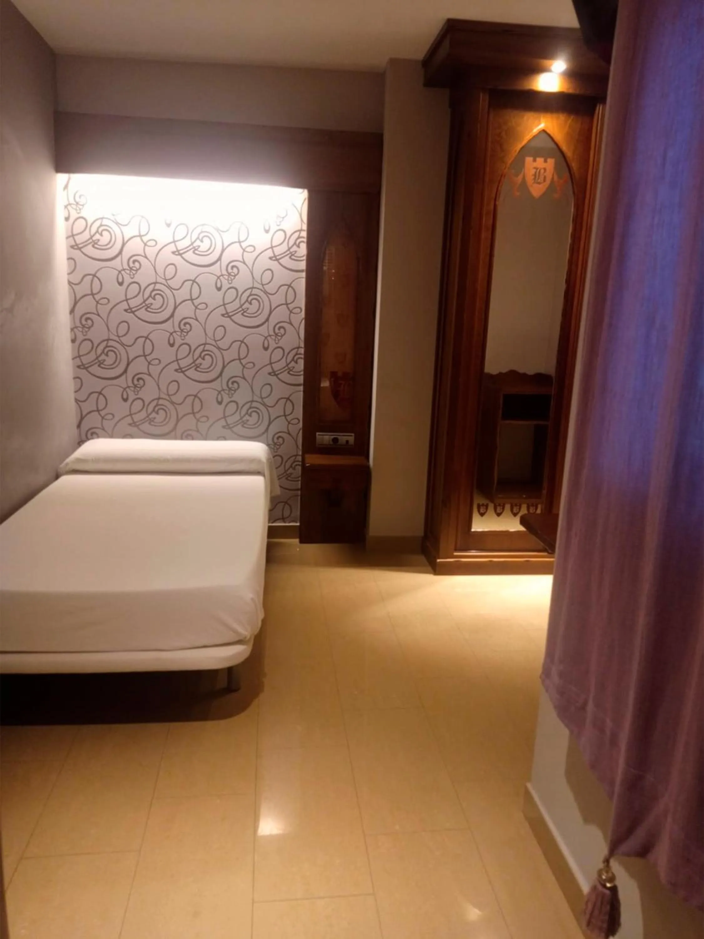 Bed, Seating Area in Hotel La Brasa