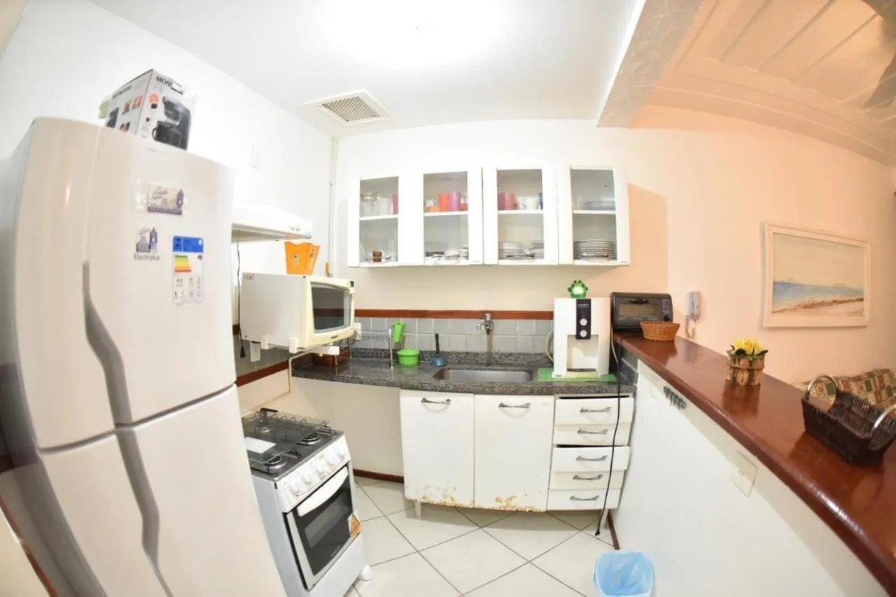 Kitchen or kitchenette in Apart Hotel em Búzios