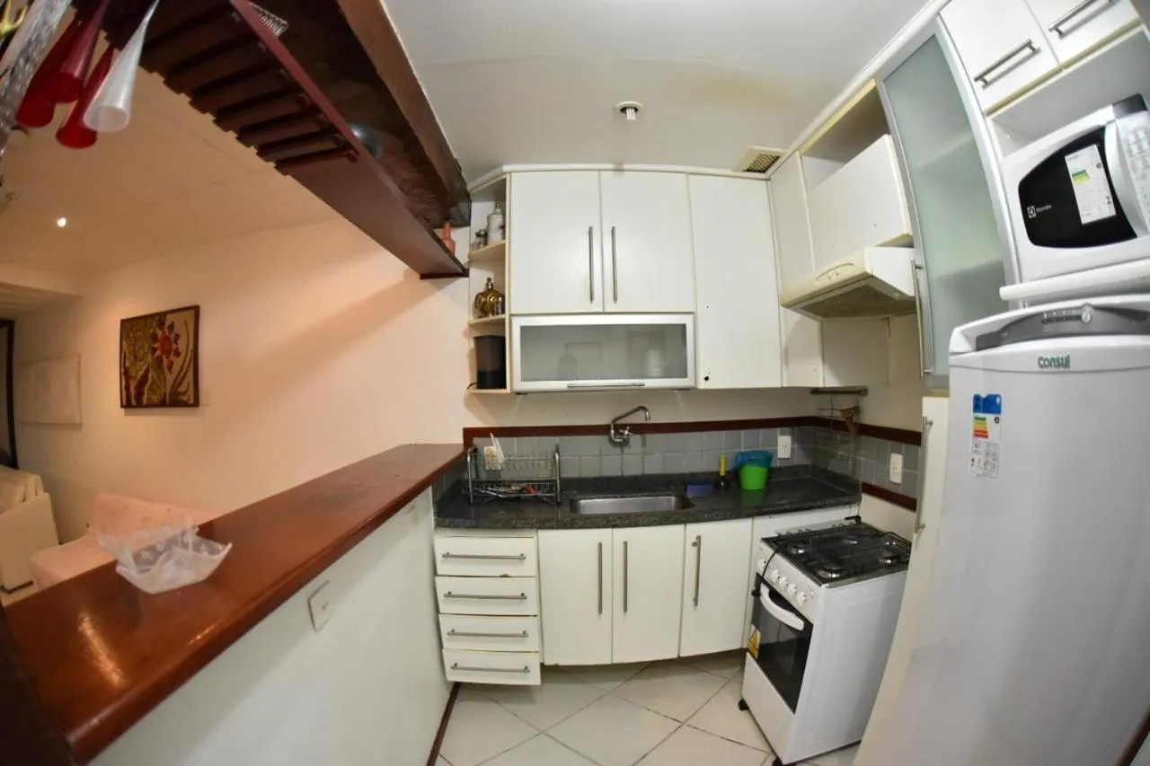 Kitchen or kitchenette in Apart Hotel em Búzios