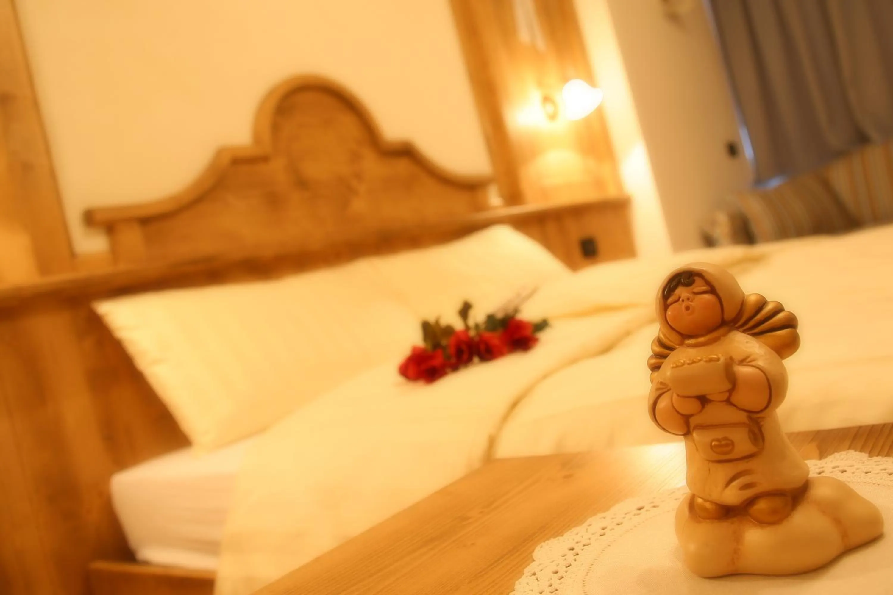 Decorative detail, Bed in Garnì Prà Fiorì