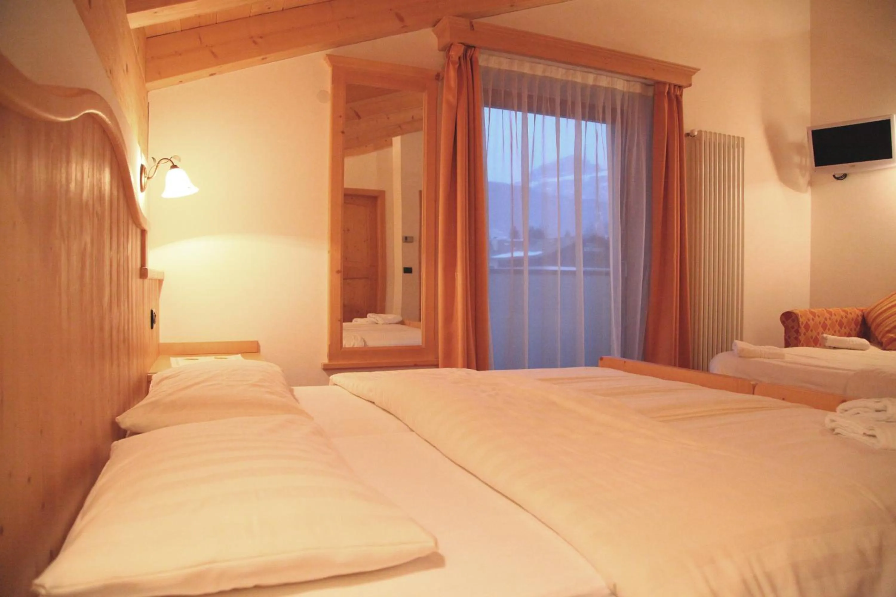 Bed in Garnì Prà Fiorì