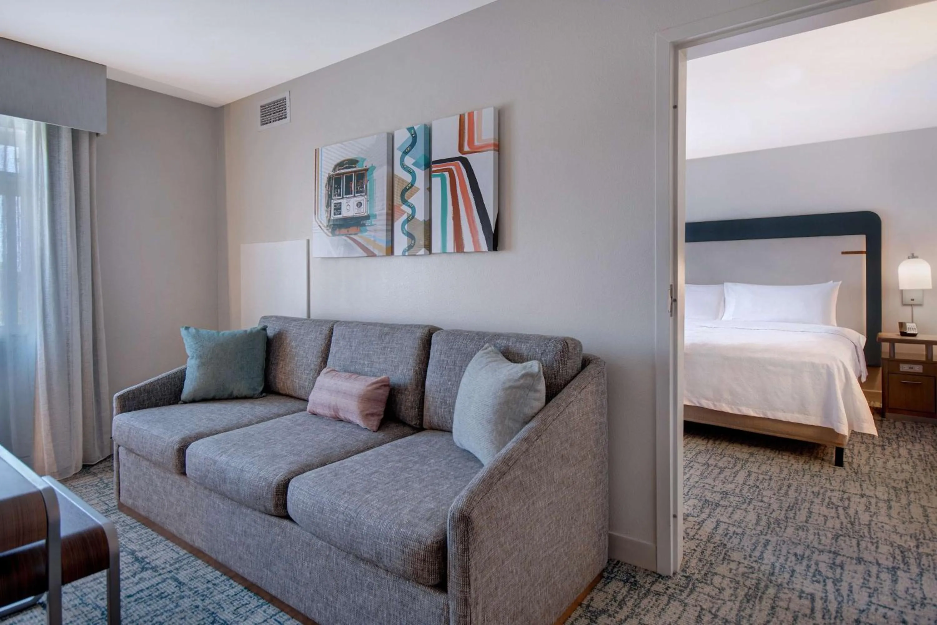Living room, Bed in Homewood Suites by Hilton San Francisco Airport North California