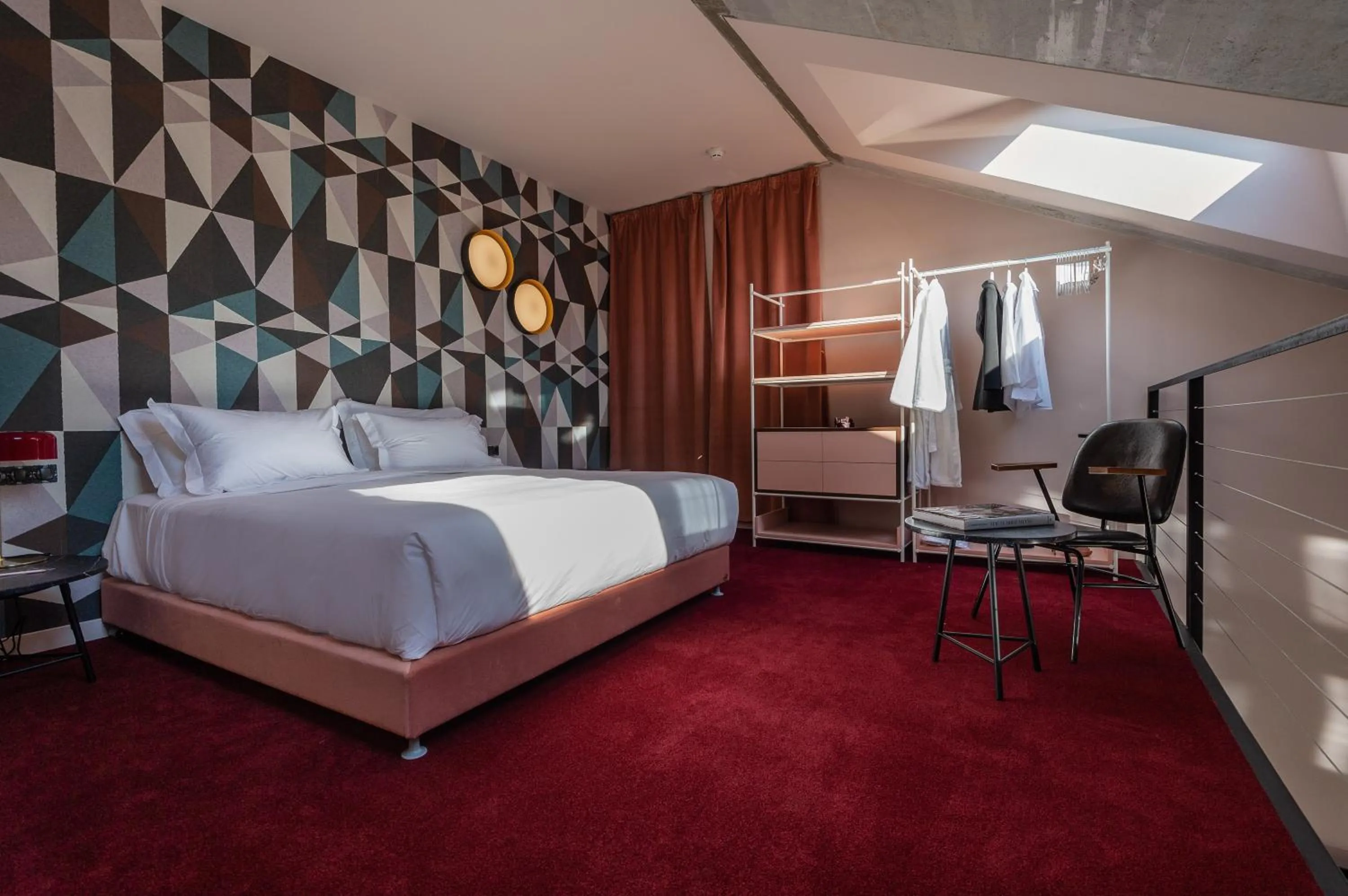 Seating area, Bed in Stories Boutique Hotel