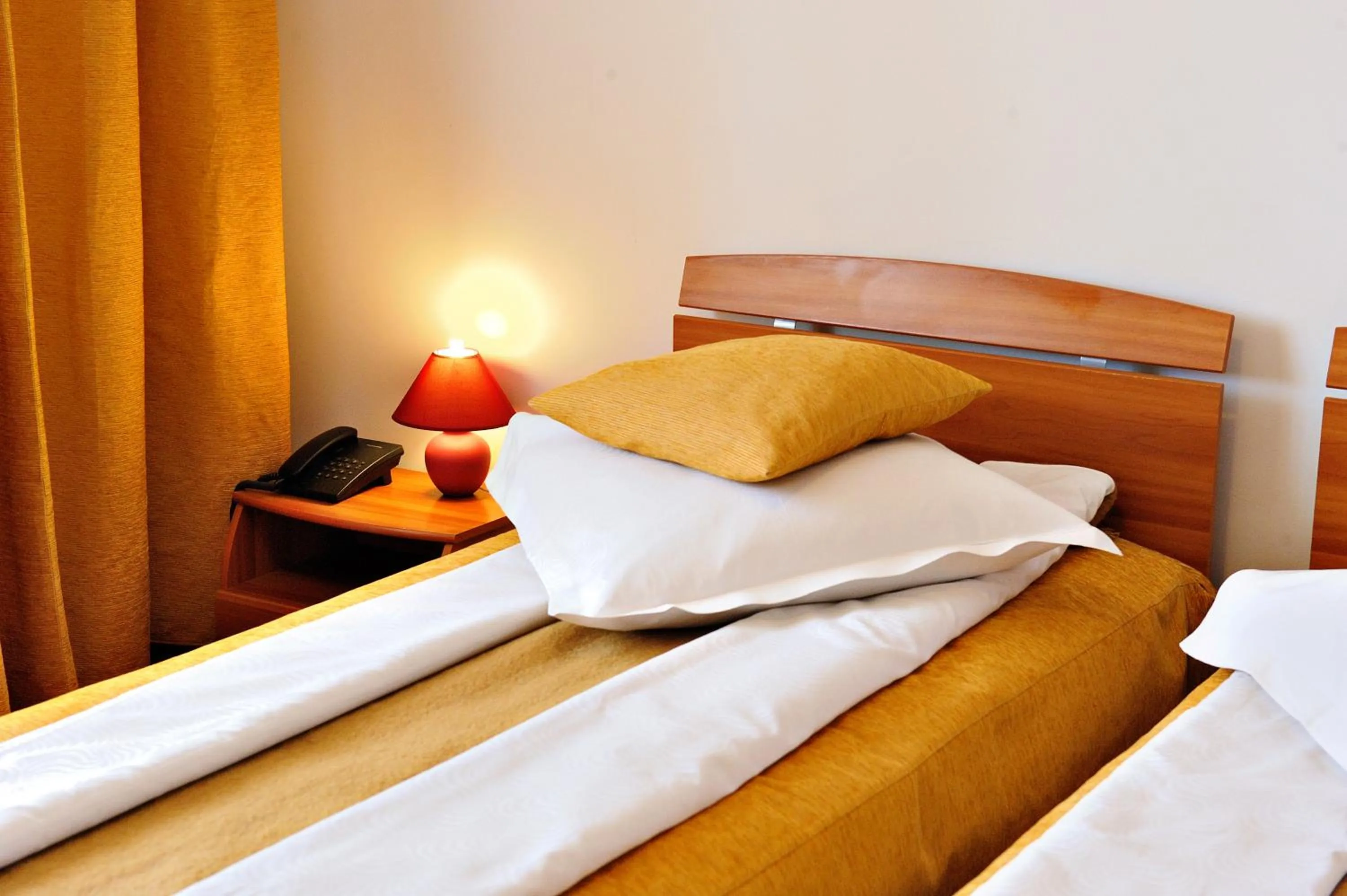 Bed in Motel Confort