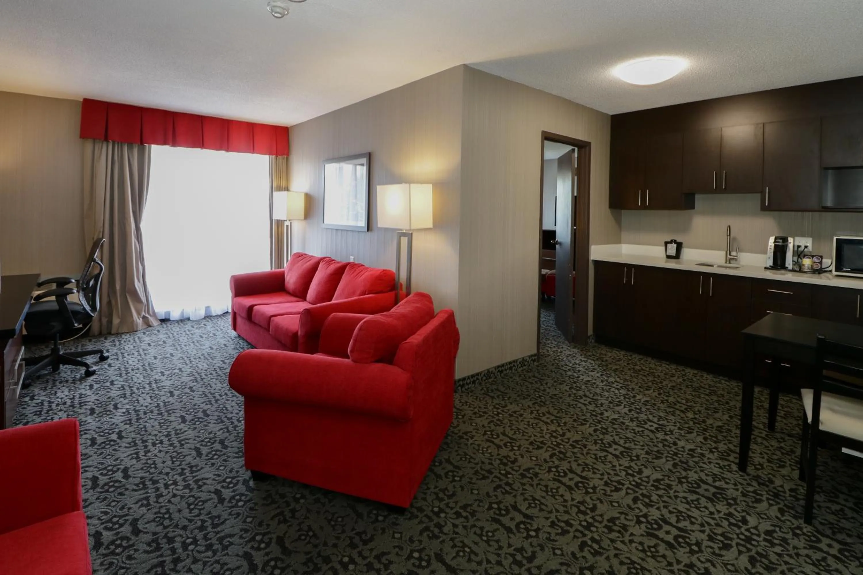 Living room in Ramada by Wyndham Jackson's Point