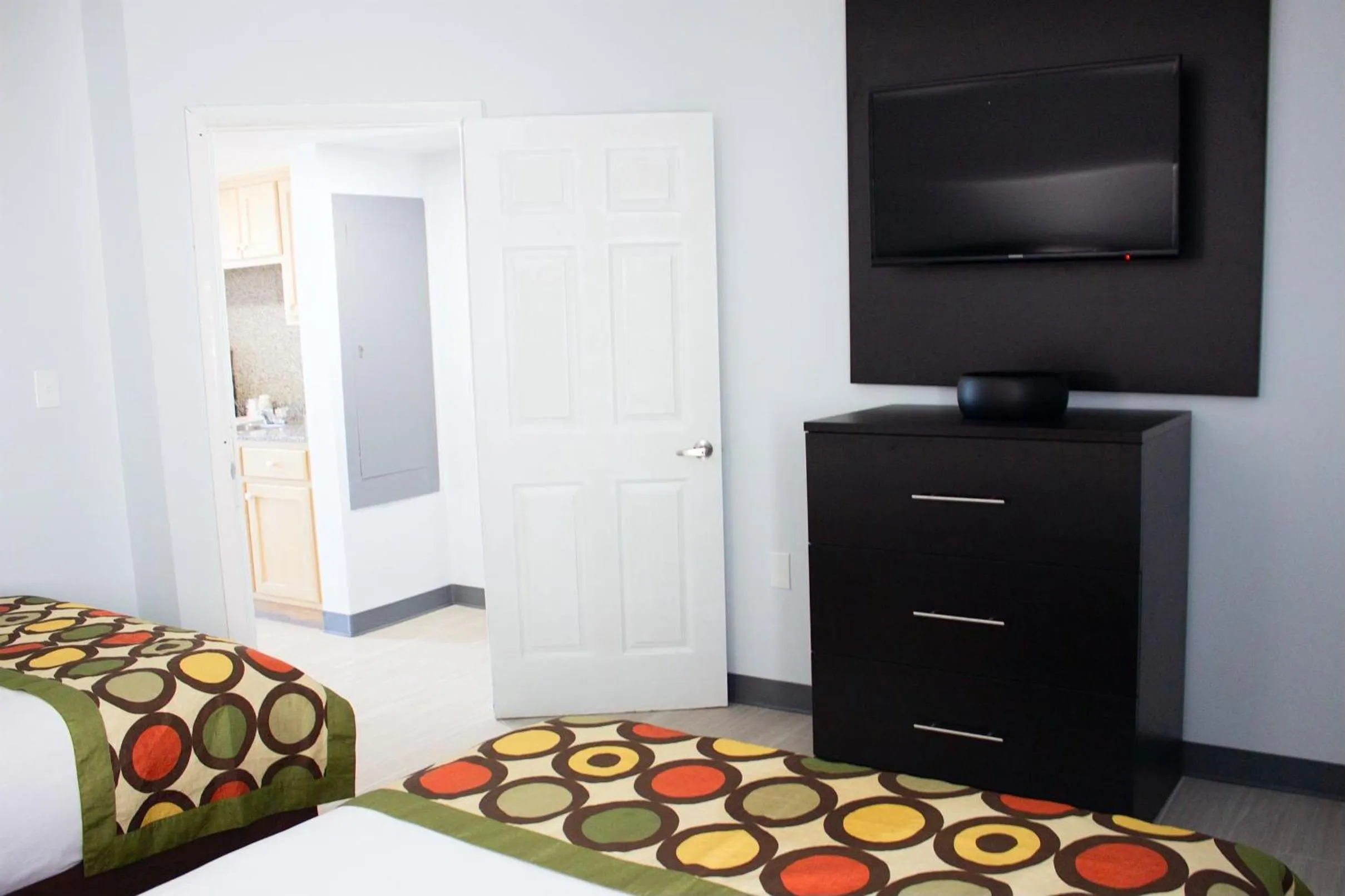 Bed in Sun & Sand Resort Oceanfront Suites