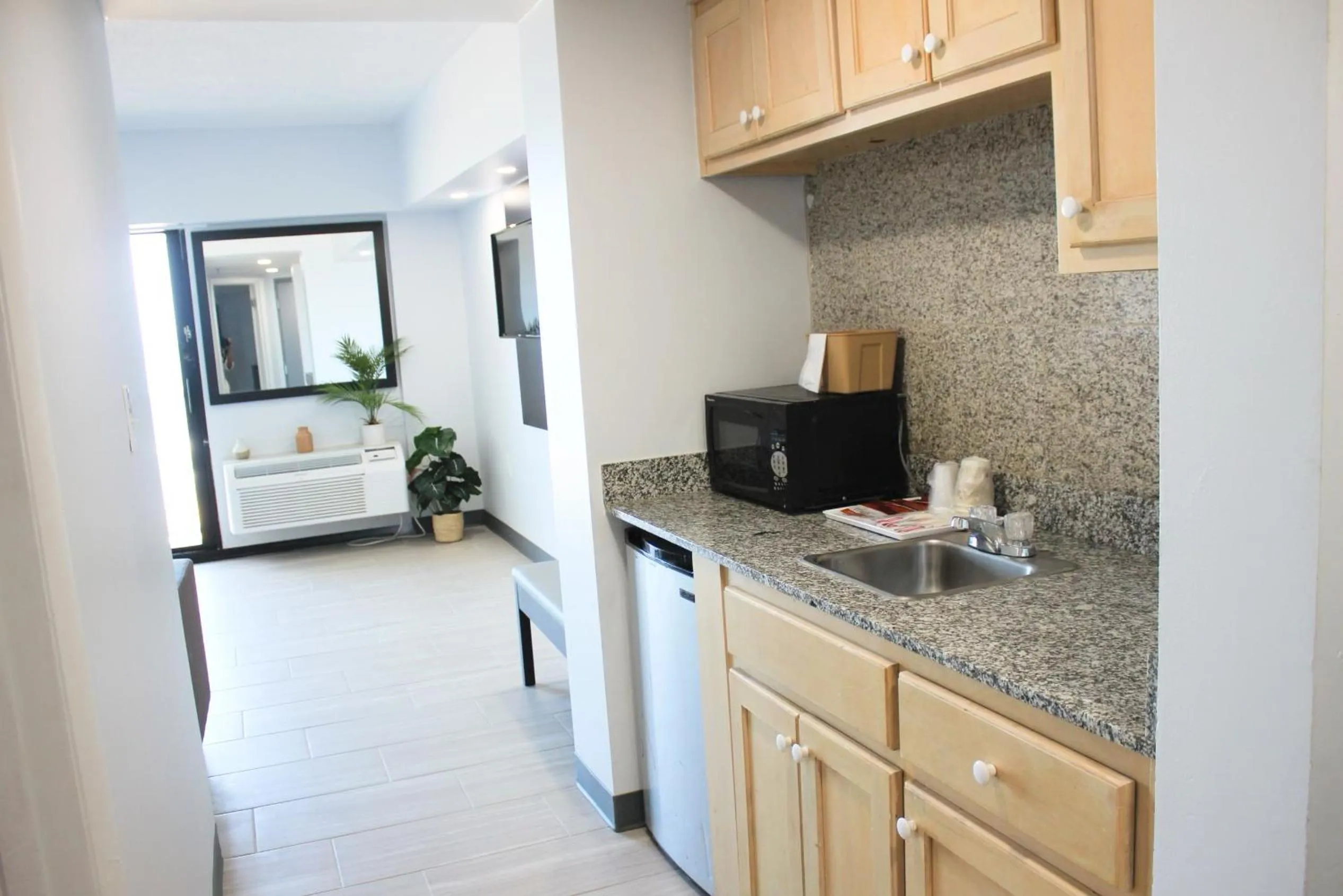 Kitchen or kitchenette in Sun & Sand Resort Oceanfront Suites