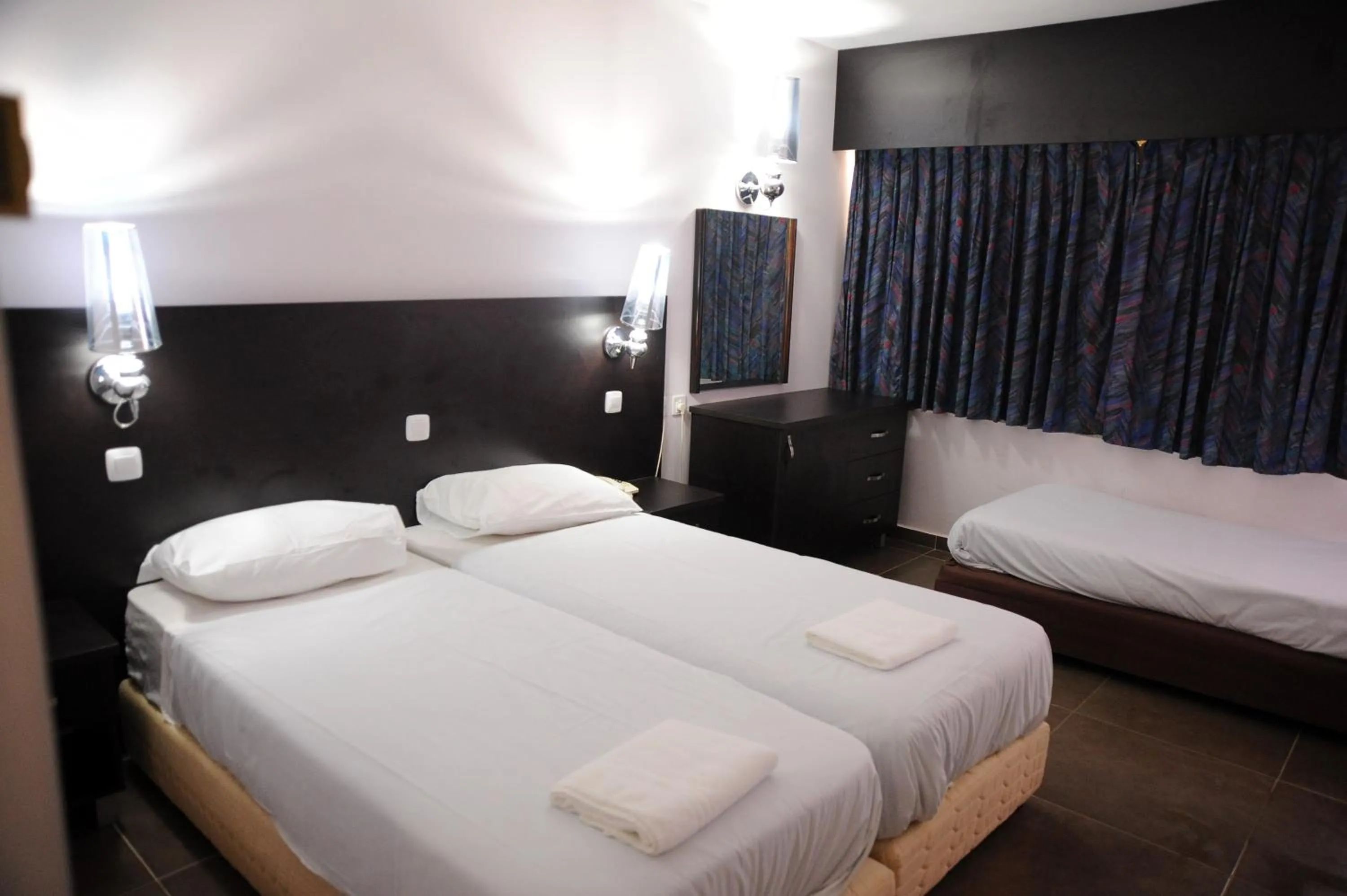 Bed in Aquamarine Hotel