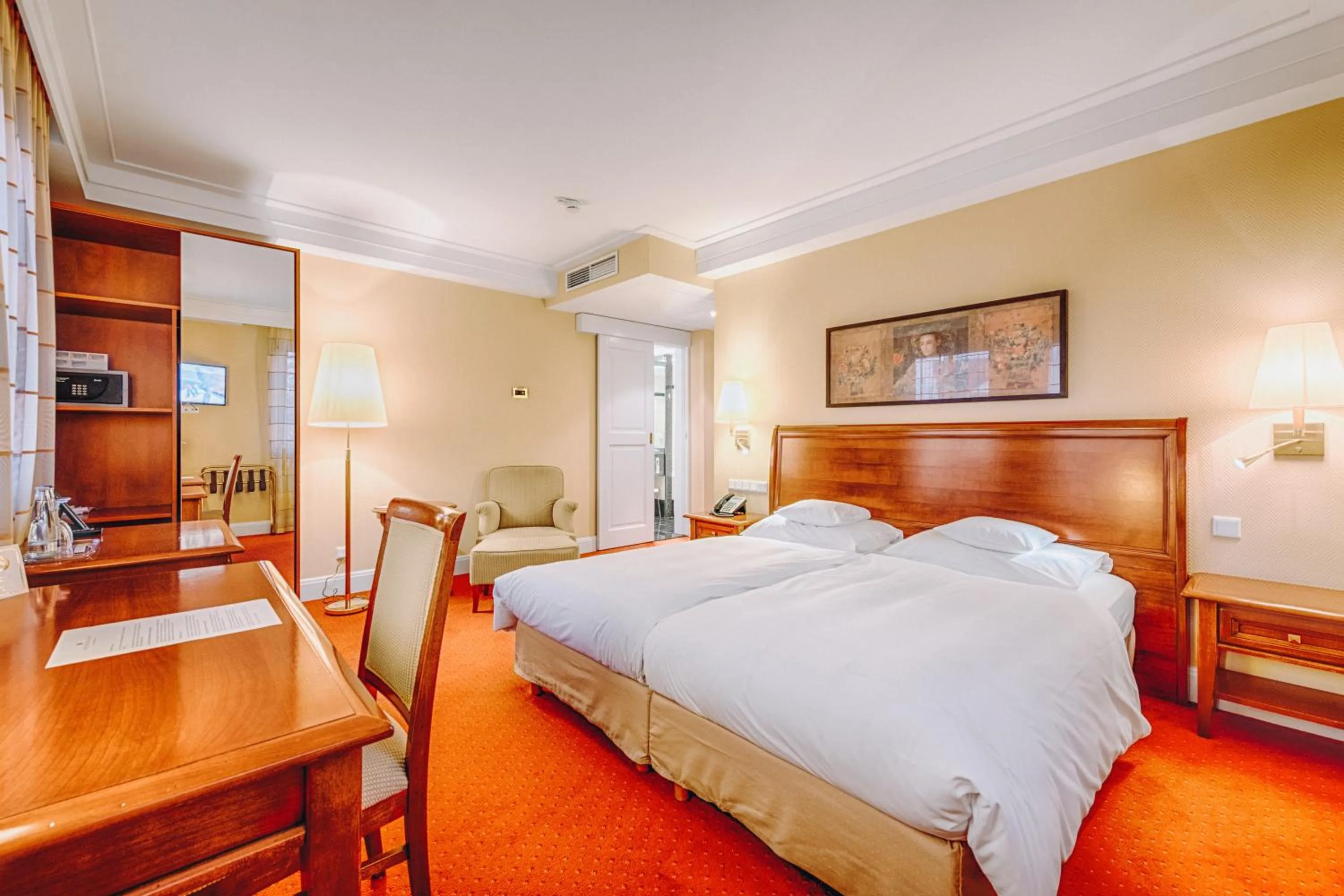 Seating area, Bed in Hotel Moosburger Hof