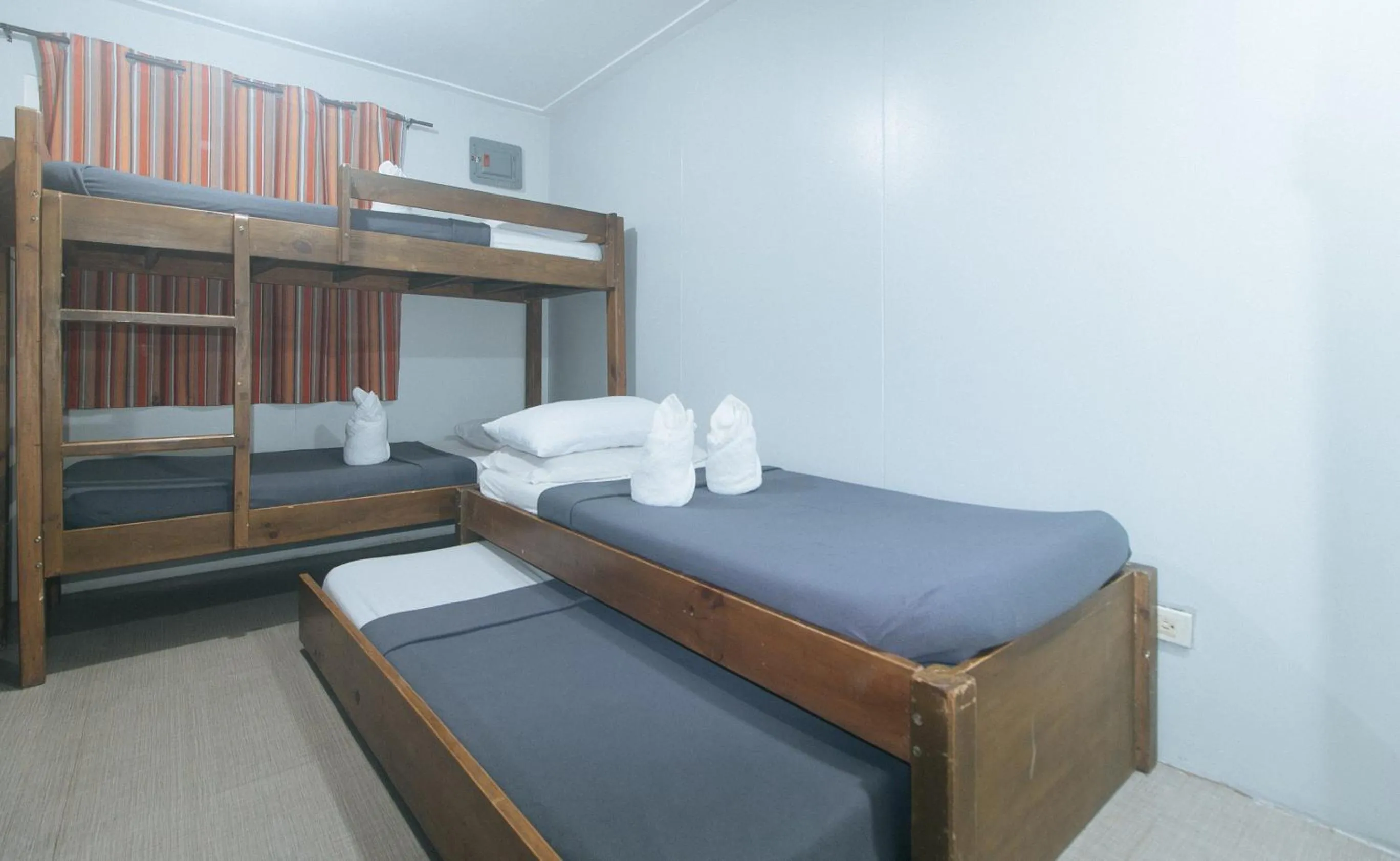 Bed in Metro Deluxe Residences near World Trade Center