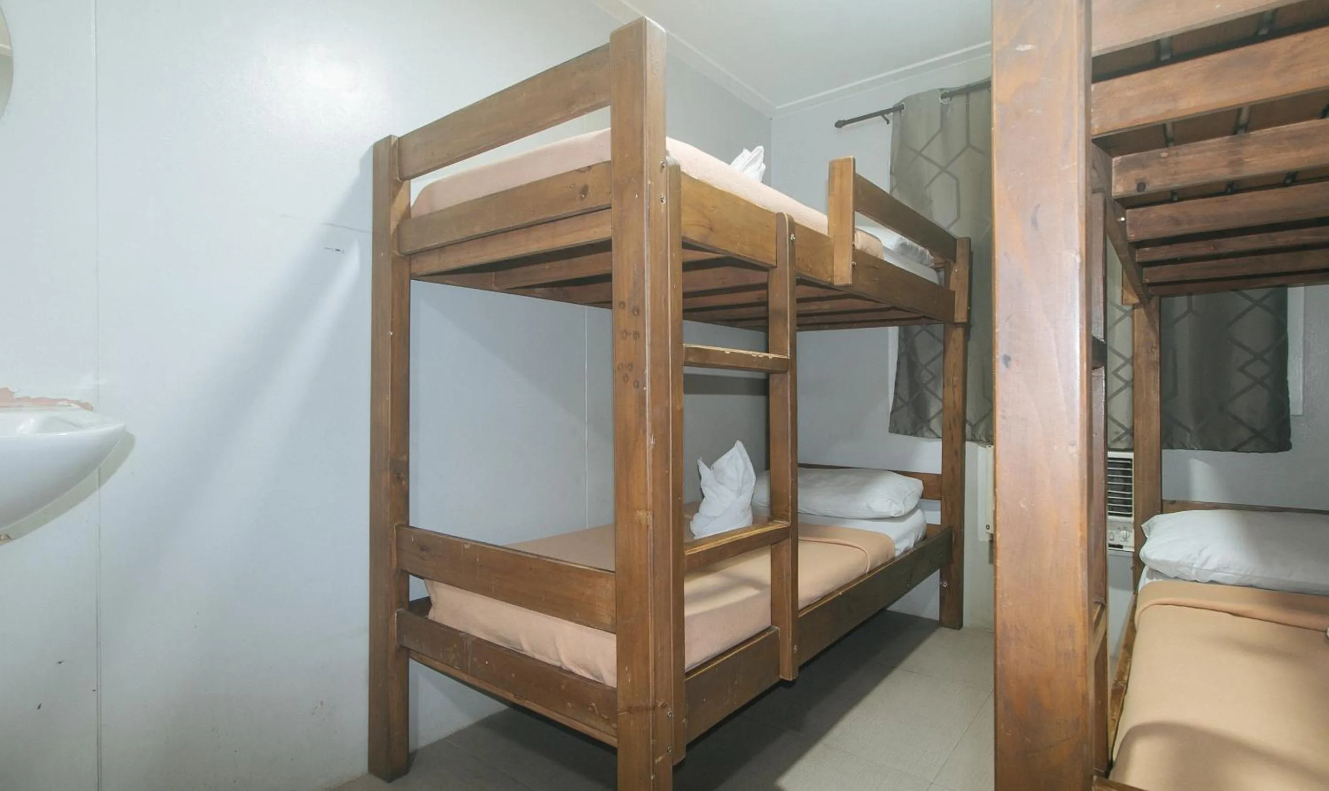 Bed in Metro Deluxe Residences near World Trade Center