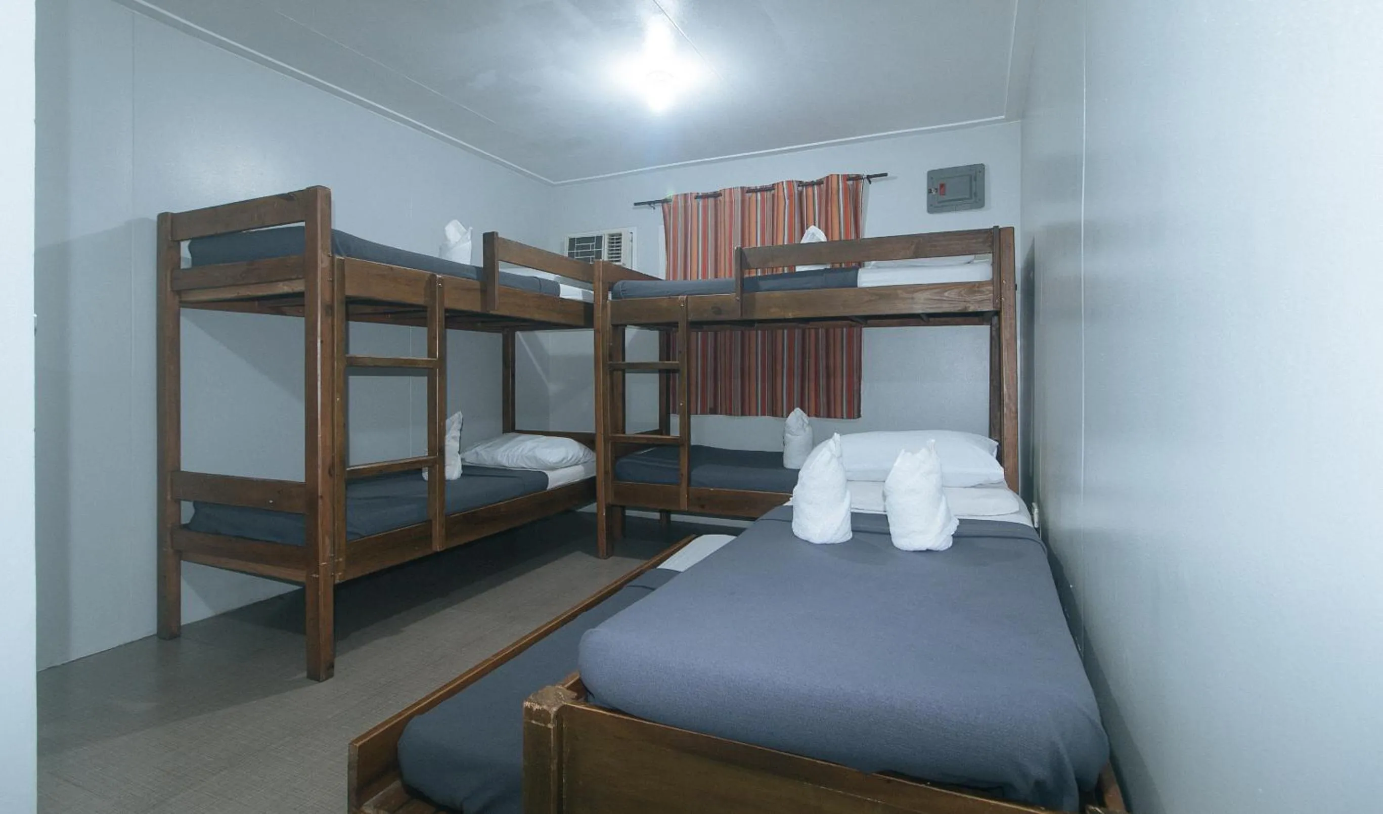 Bed in Metro Deluxe Residences near World Trade Center