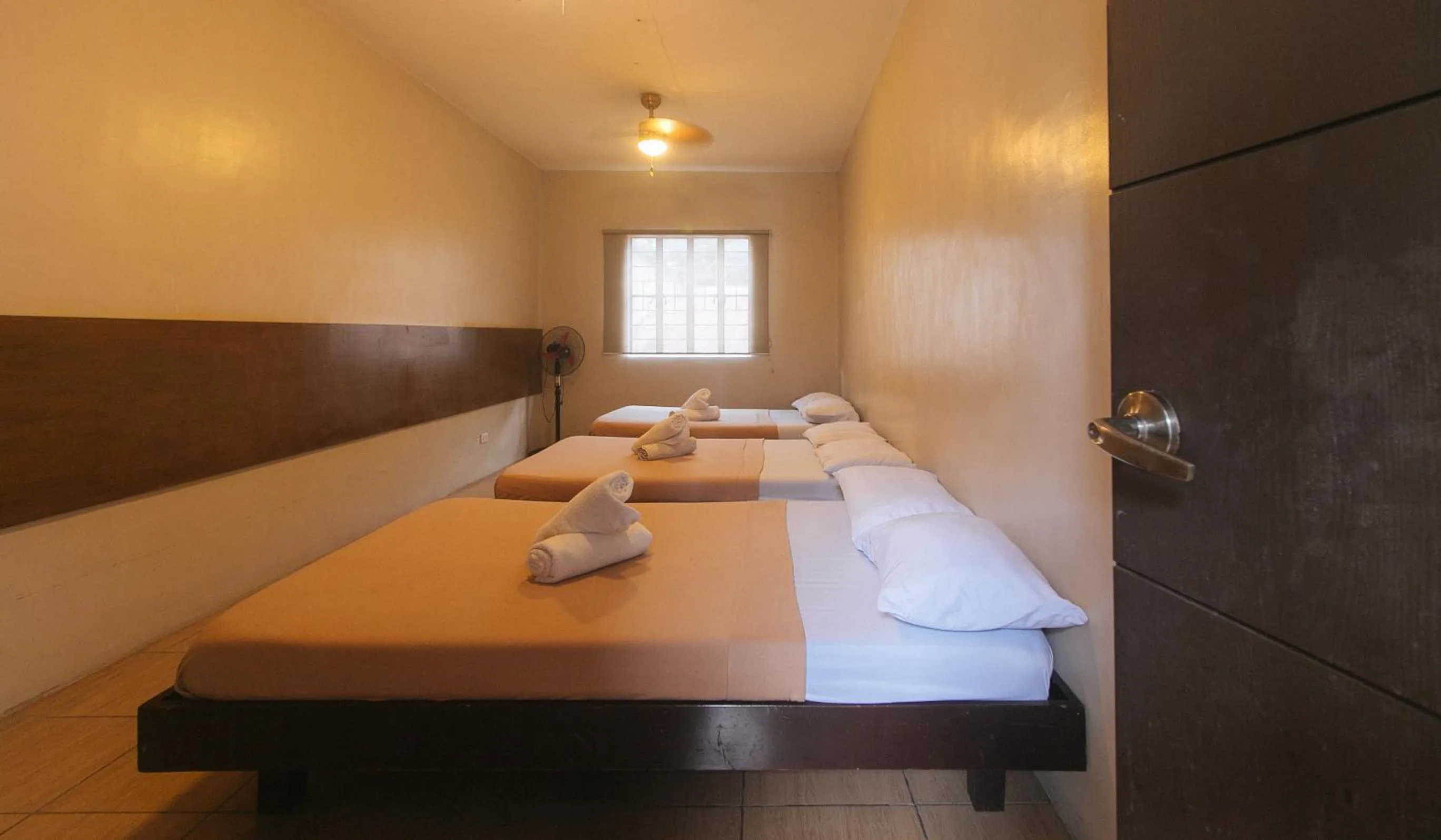 Bed in Metro Deluxe Residences near World Trade Center