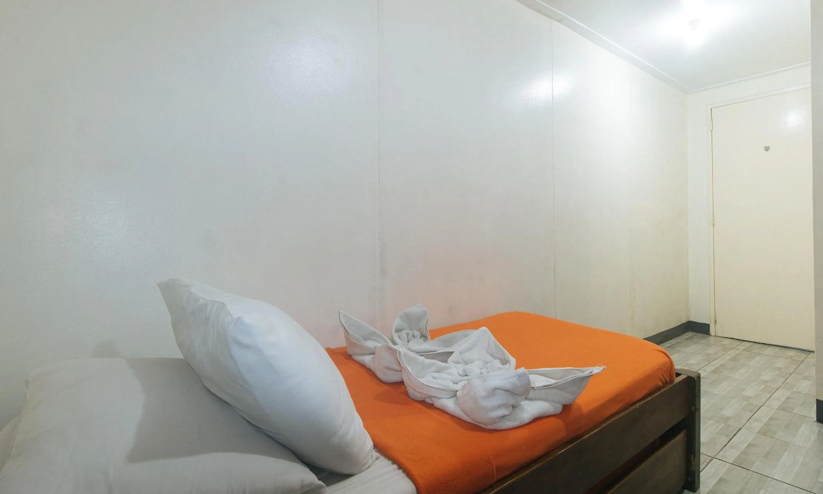 Bed in Metro Deluxe Residences near World Trade Center