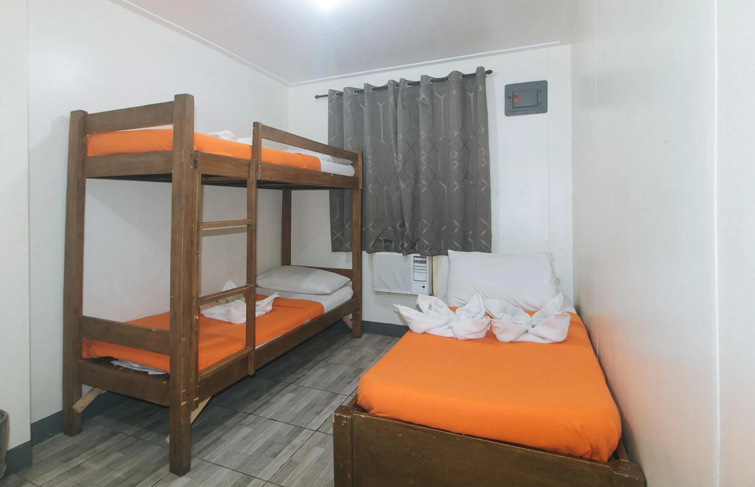 Bed in Metro Deluxe Residences near World Trade Center