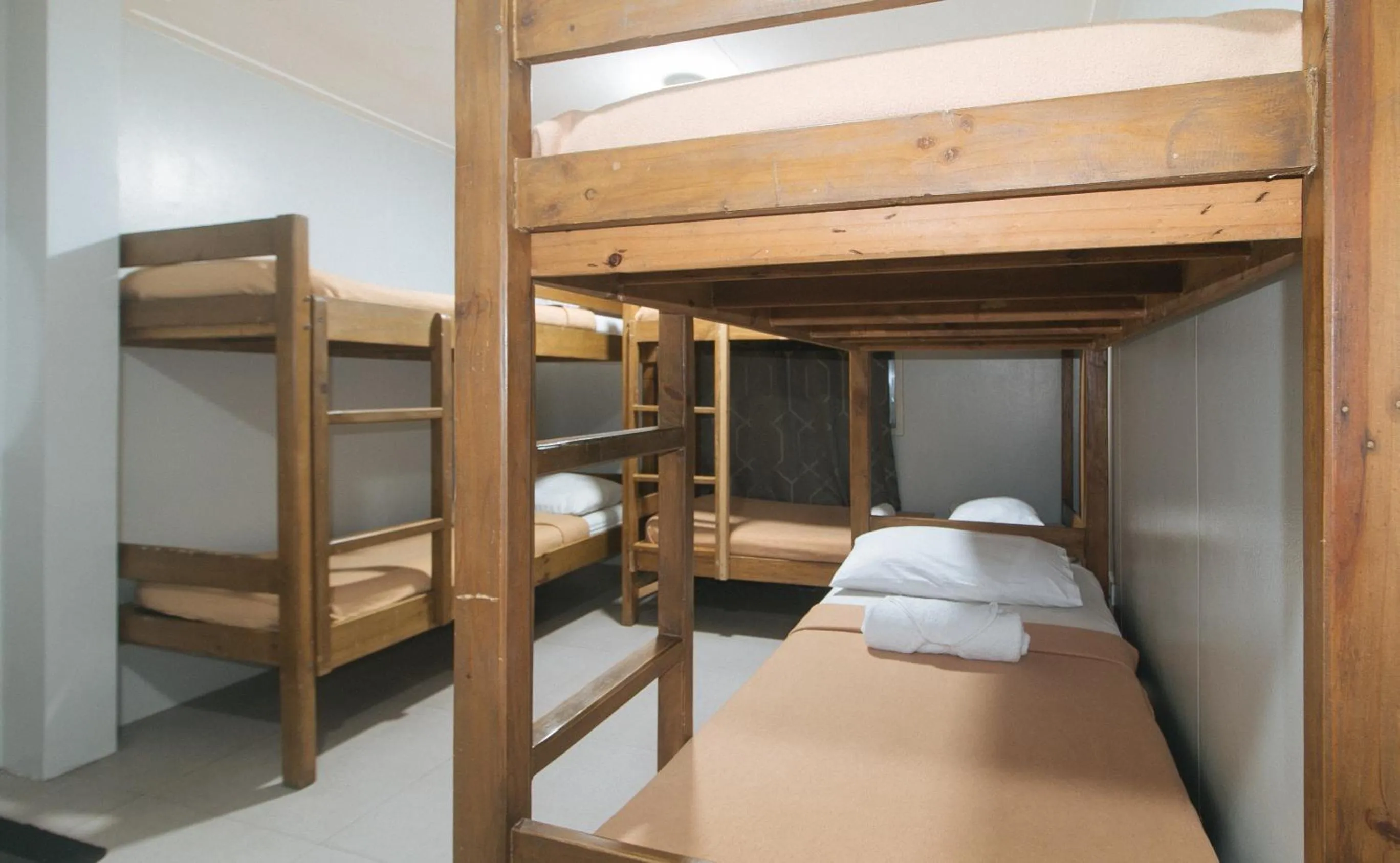 Bed in Metro Deluxe Residences near World Trade Center