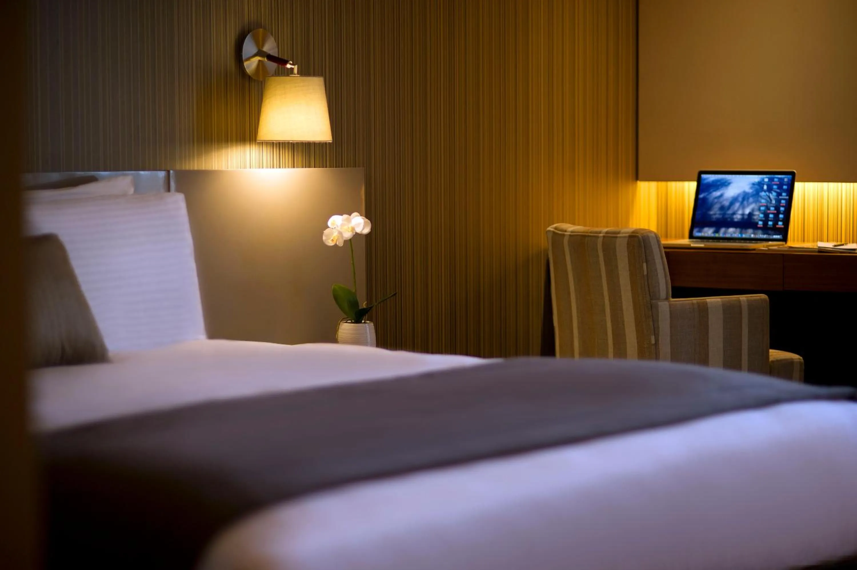 Bed in ParkTower Suites