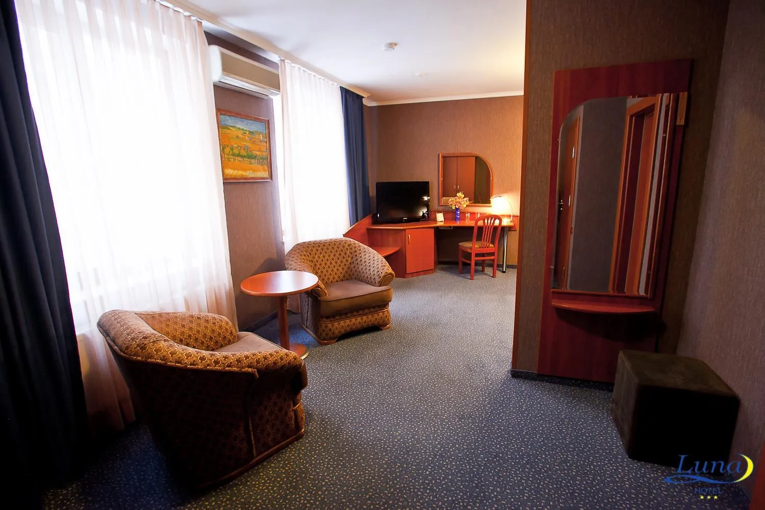 Communal lounge/ TV room in Luna Hotel