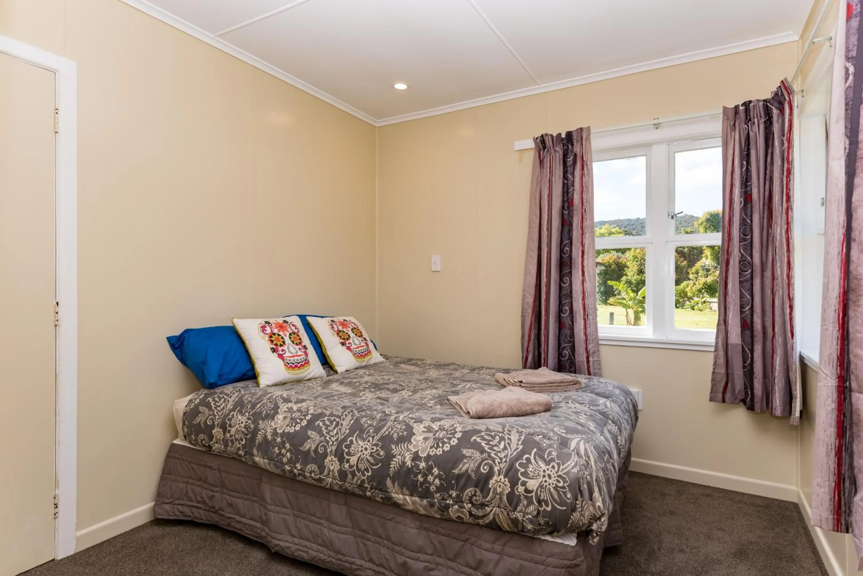 Bedroom in Waitangi Beach Bach 30B