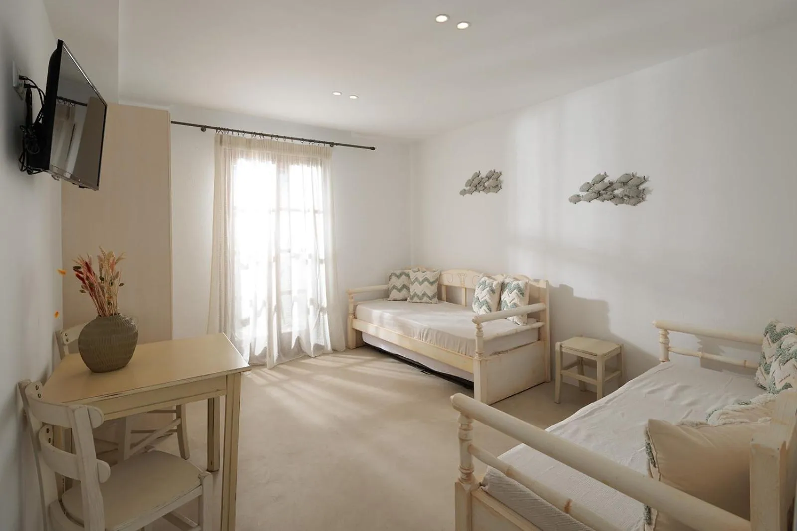 Seating area, Bed in Anemomilos Beach hotel