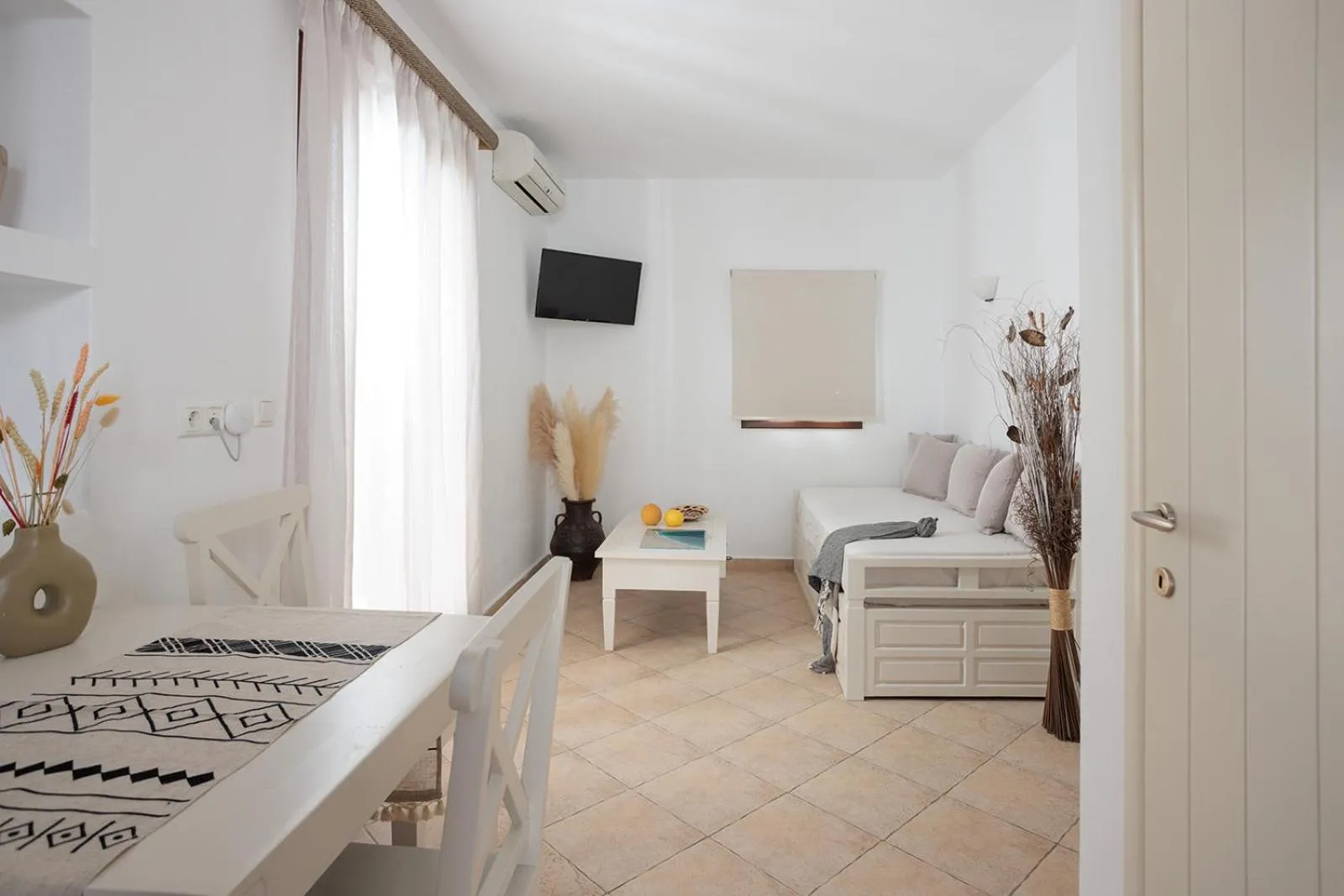 Seating area, Bed in Anemomilos Beach hotel