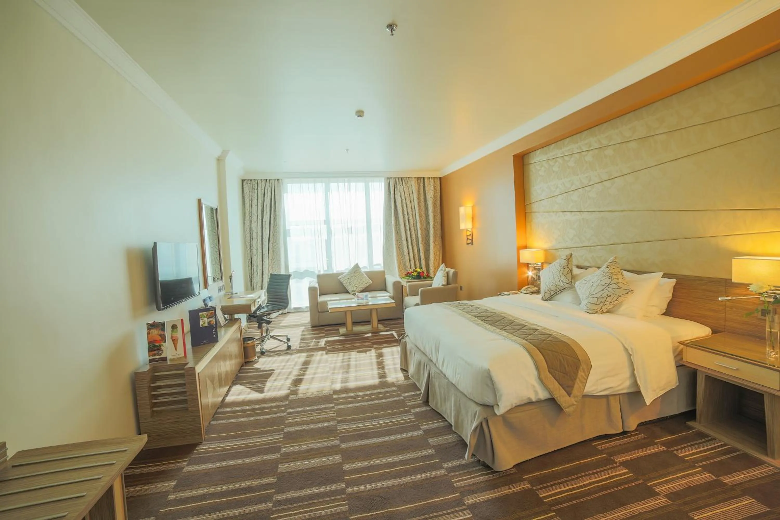 Living room, Bed in Golden Tulip Hotel Buraidah Al Qassim