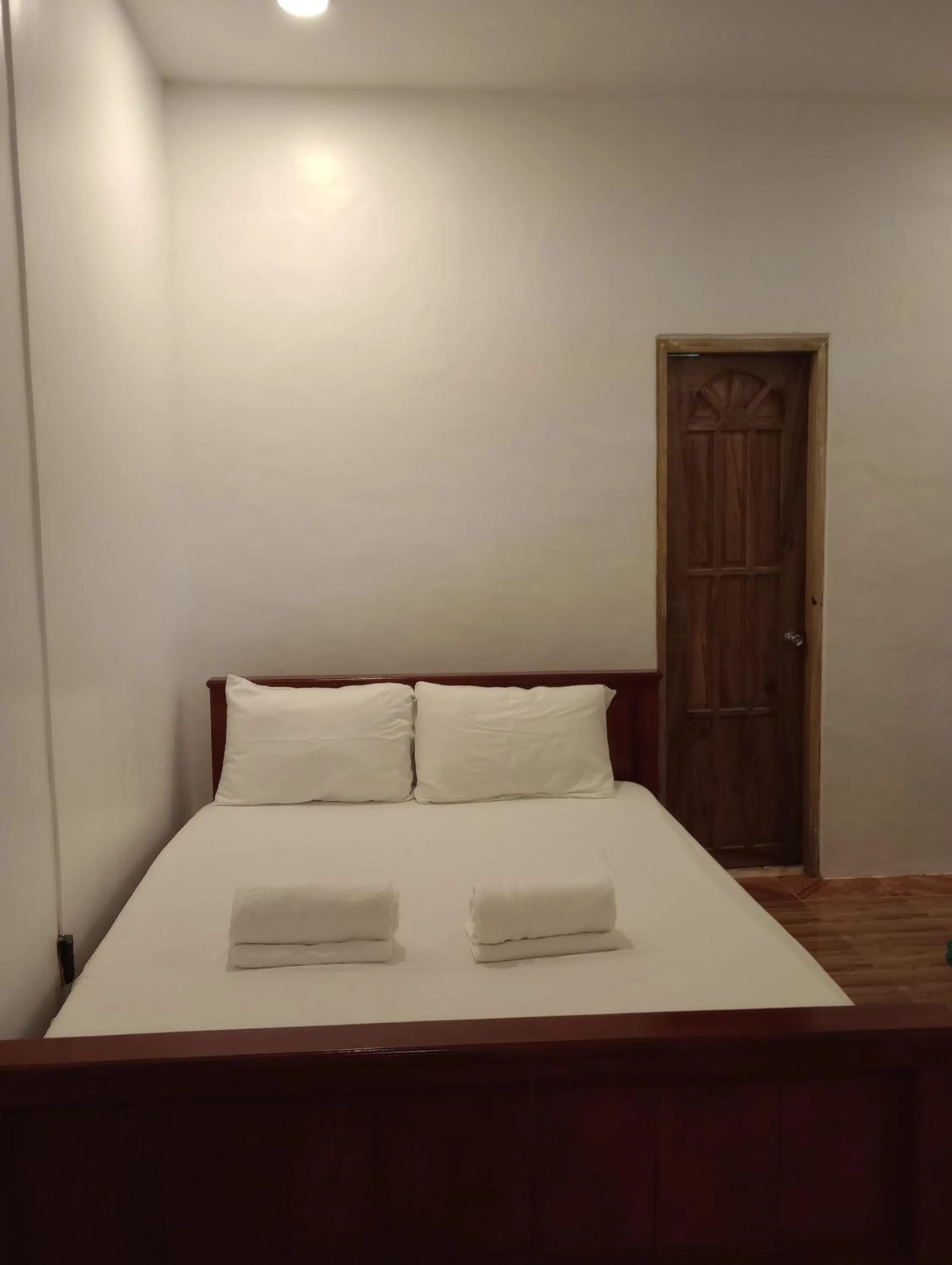 Bed in Seaside traveler's Inn by Camiguin Island Home