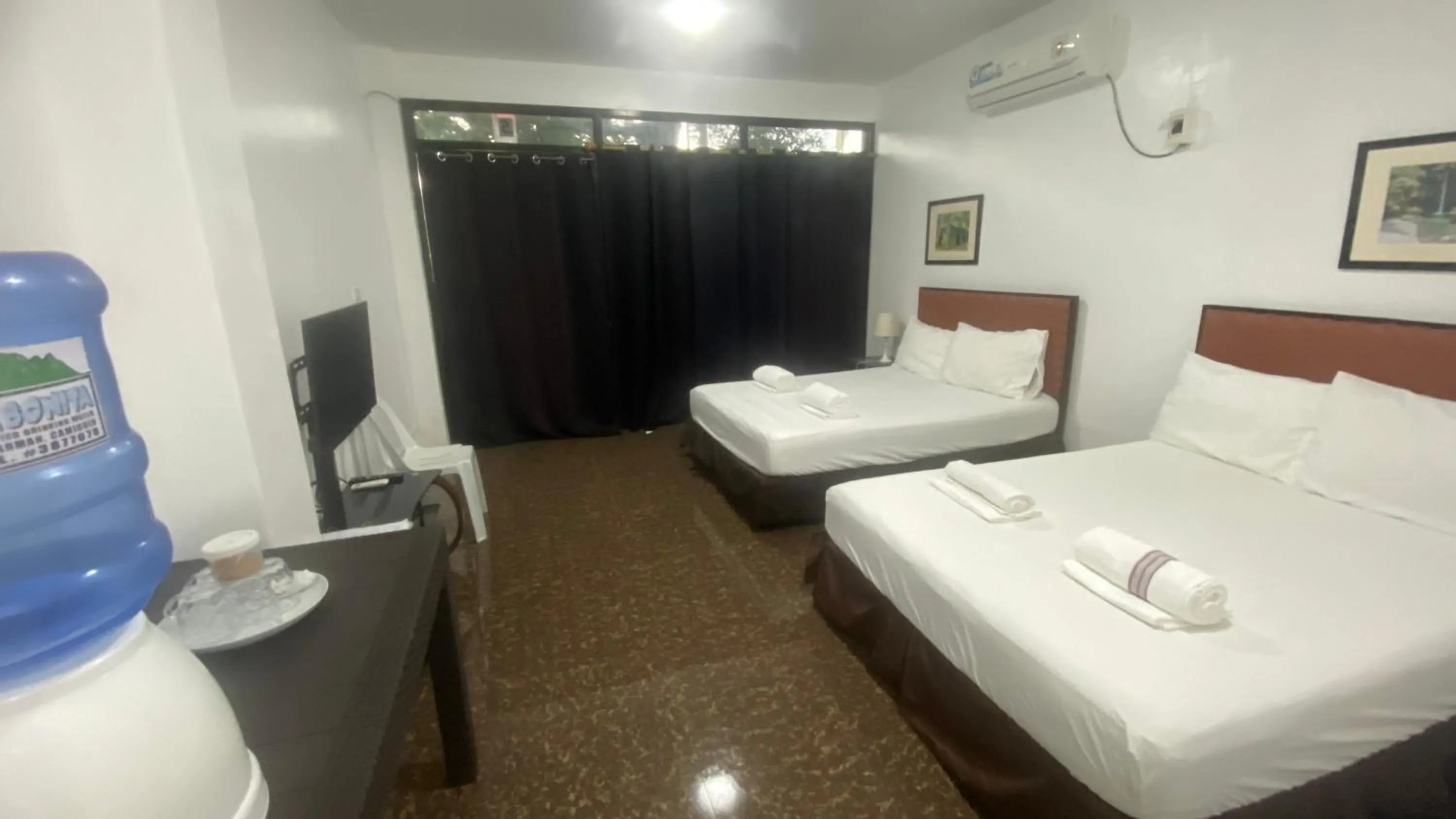 Bedroom, Bed in Seaside traveler's Inn by Camiguin Island Home