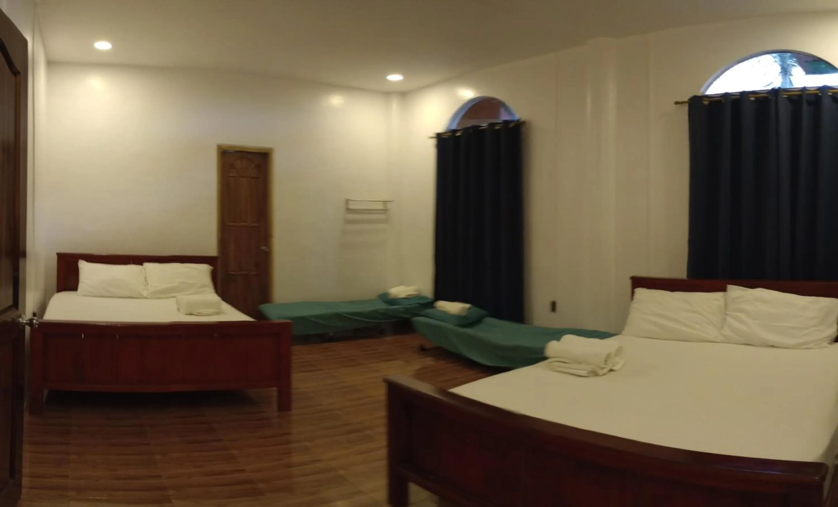 Bedroom, Bed in Seaside traveler's Inn by Camiguin Island Home