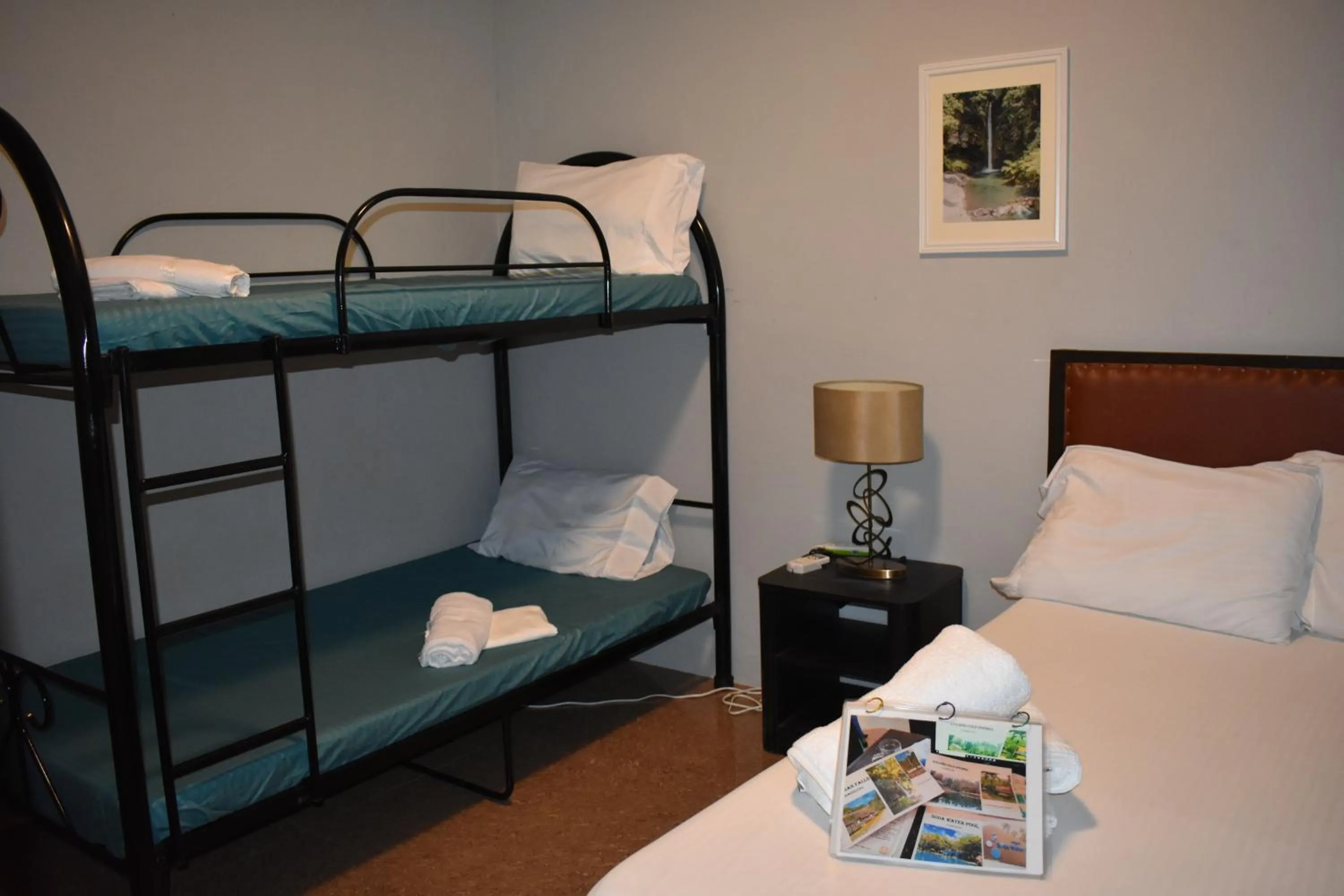 Bed in Seaside traveler's Inn by Camiguin Island Home