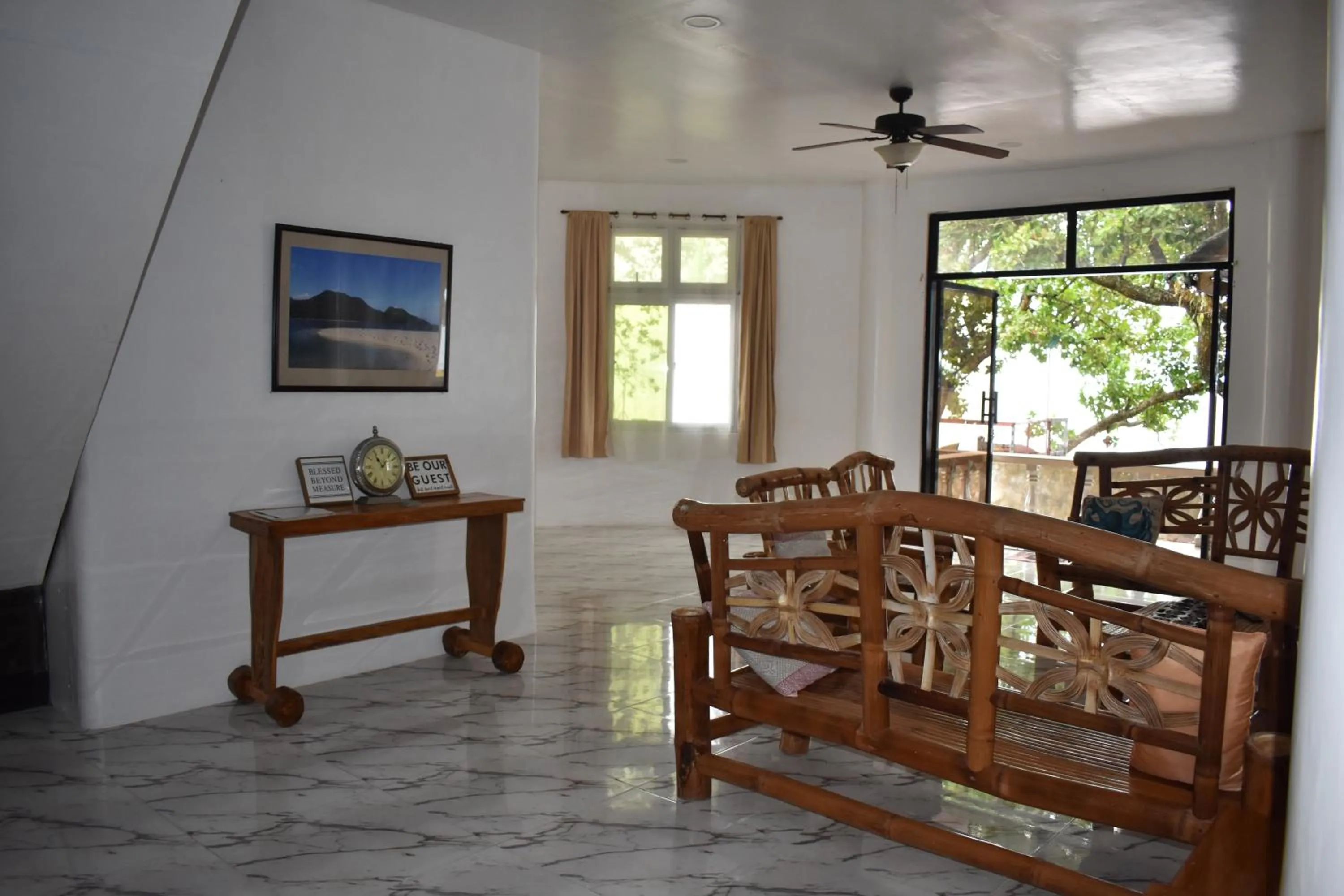 Living room in Seaside traveler's Inn by Camiguin Island Home