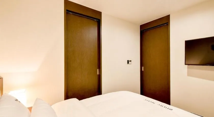 Bed in Blanc Business Hotel