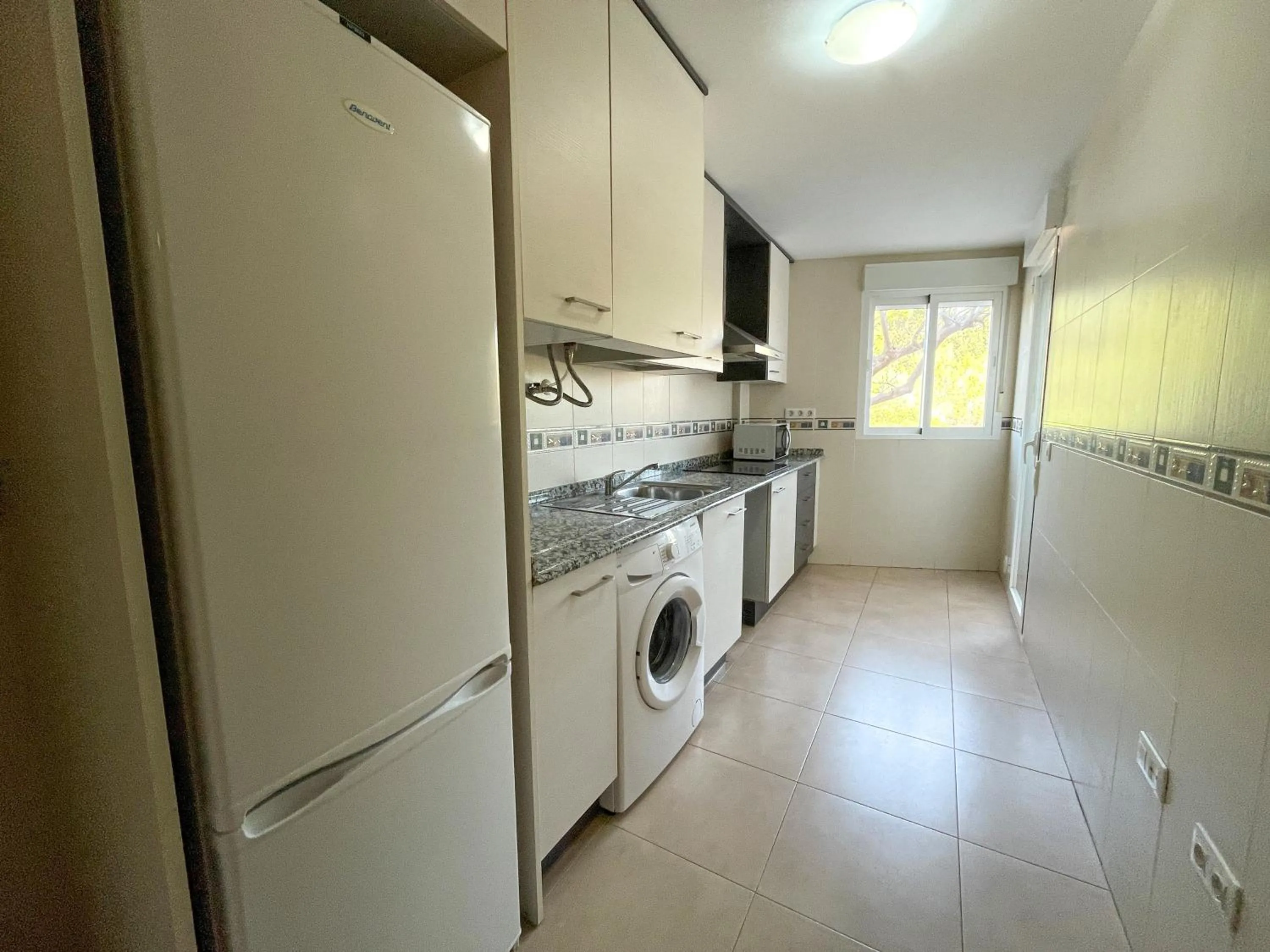 Kitchen or kitchenette in Apartamentos Neptuno 3000
