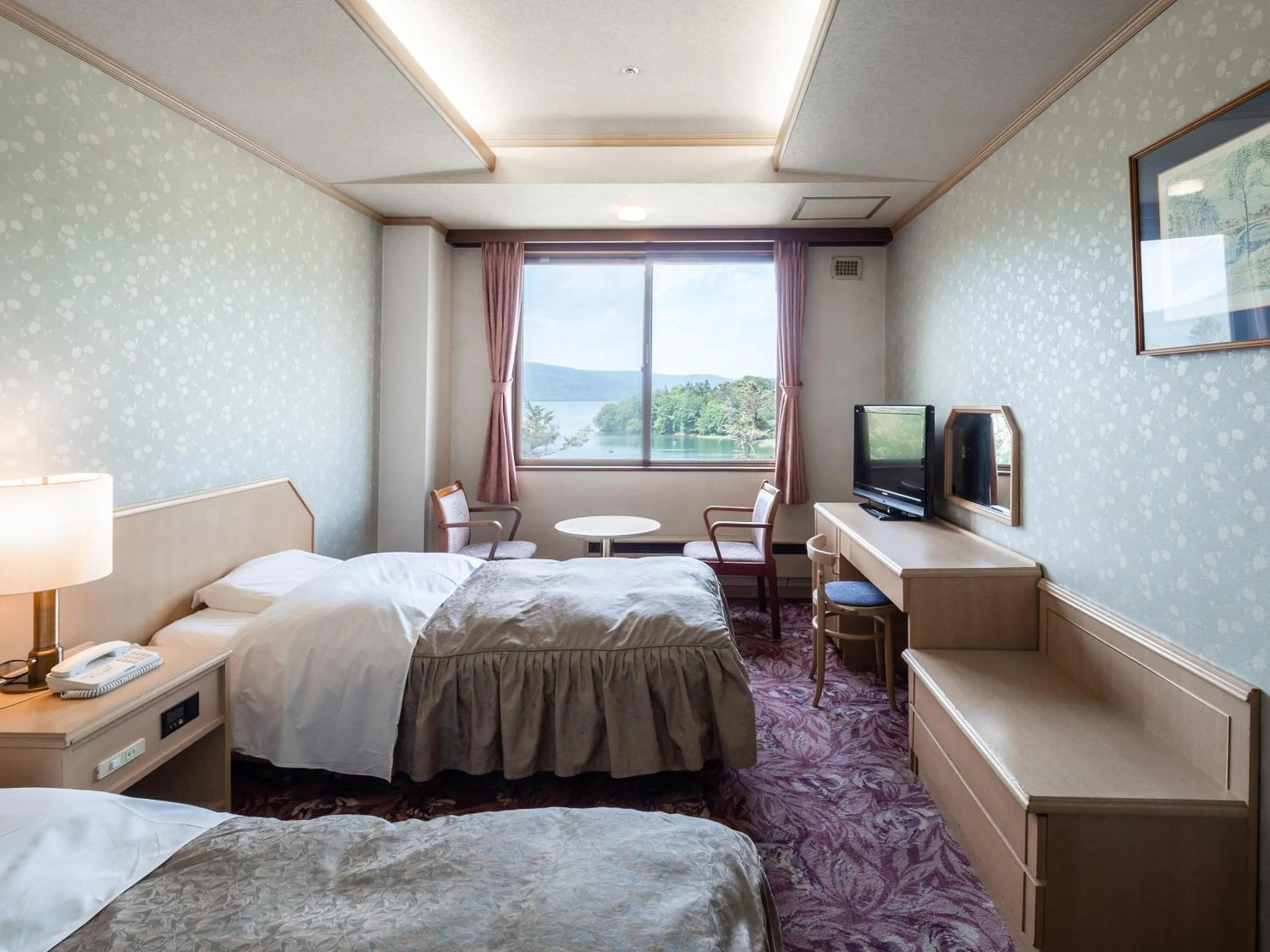 Photo of the whole room, Bed in New Akan Hotel