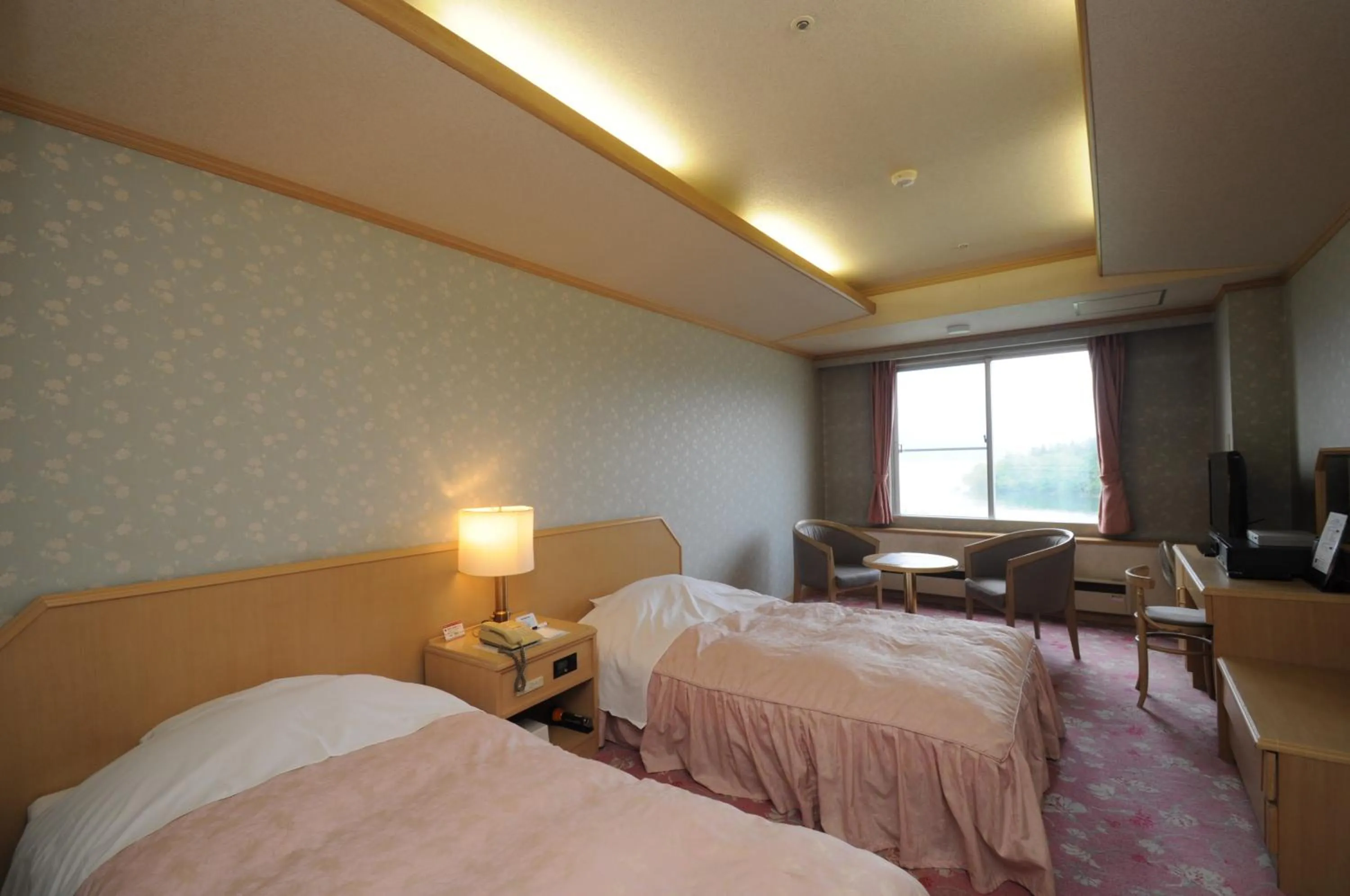 Photo of the whole room, Bed in New Akan Hotel