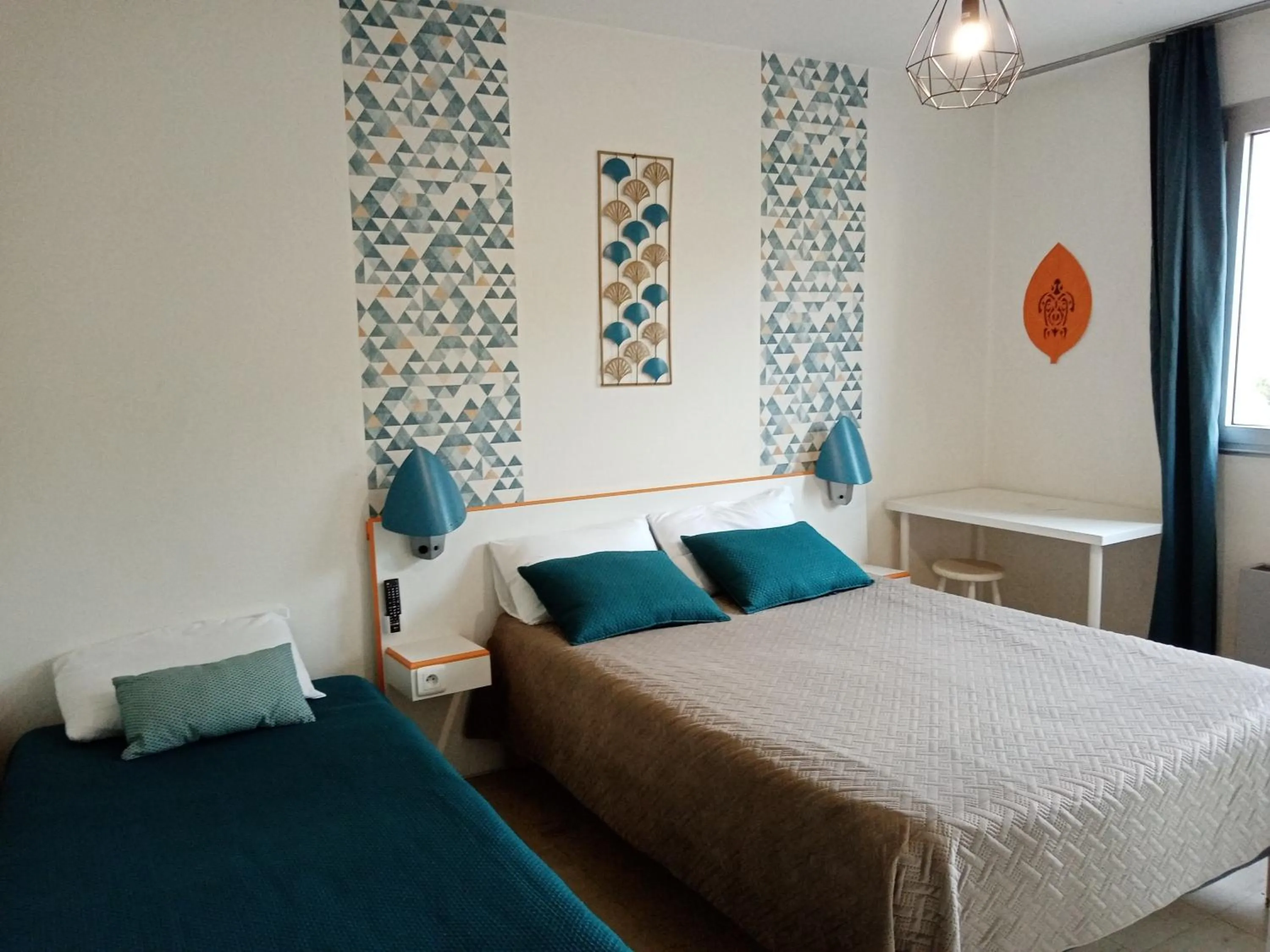 Bed in hotel l'échappée d'oléron