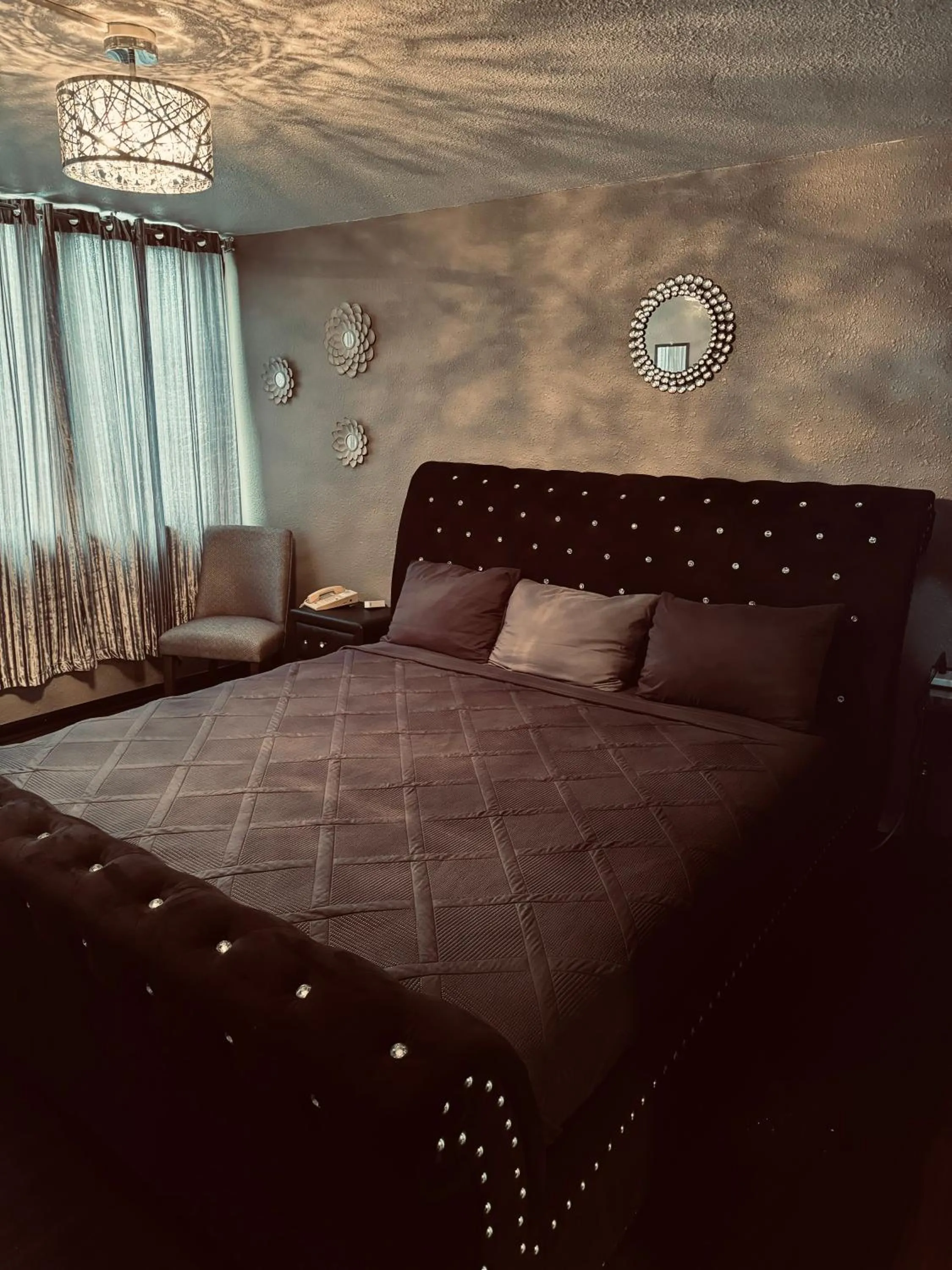 Bed in The Village Inn Hotel