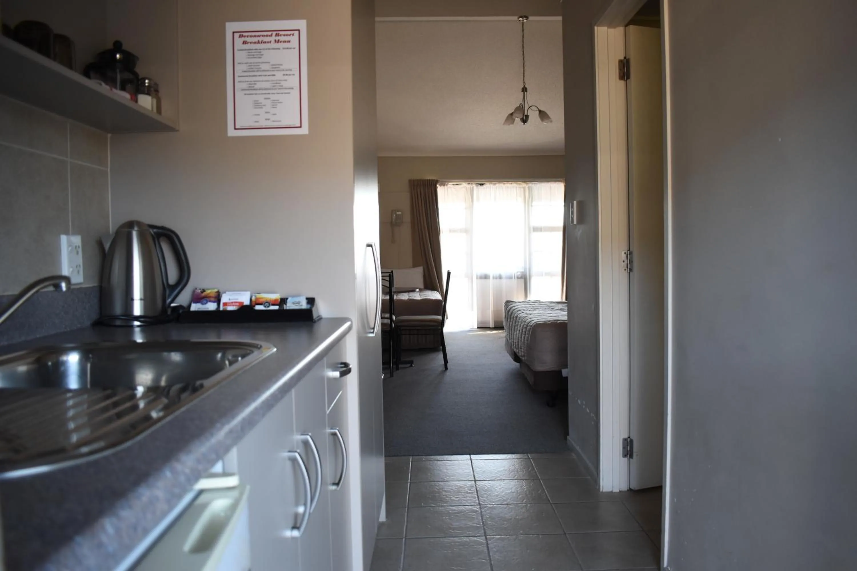 Kitchen or kitchenette in Devonwood Motel