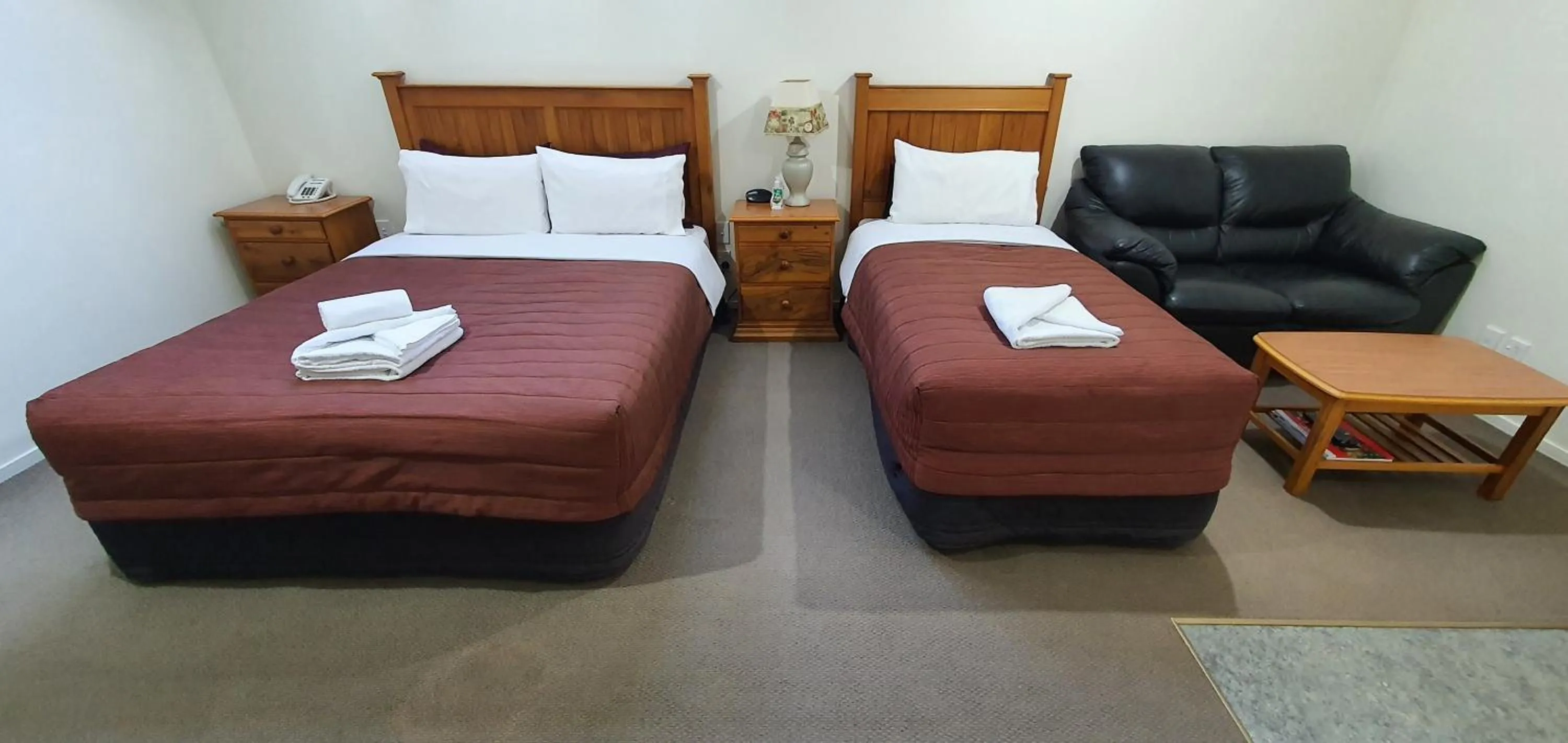 Bed in Rosewood Court Motel