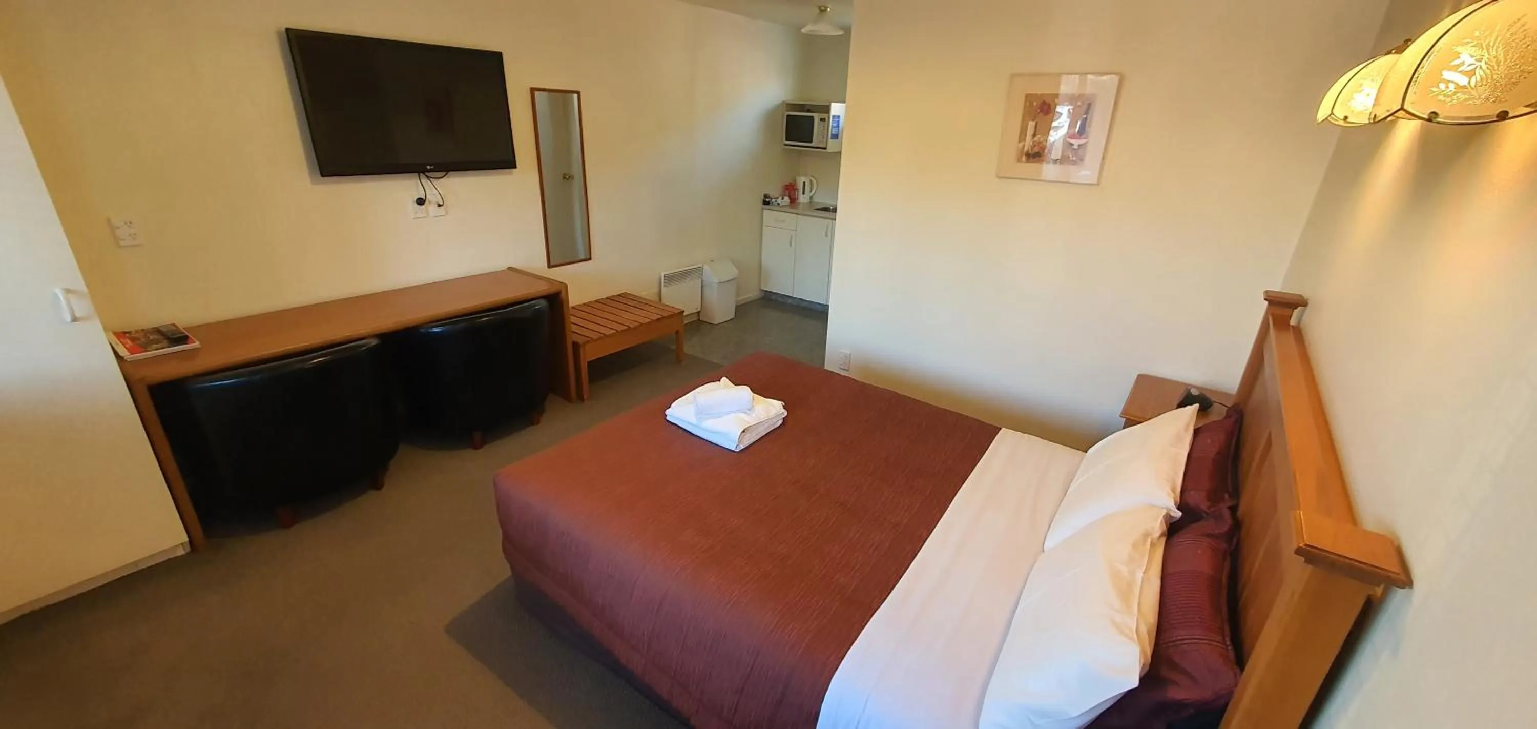 Bed in Rosewood Court Motel