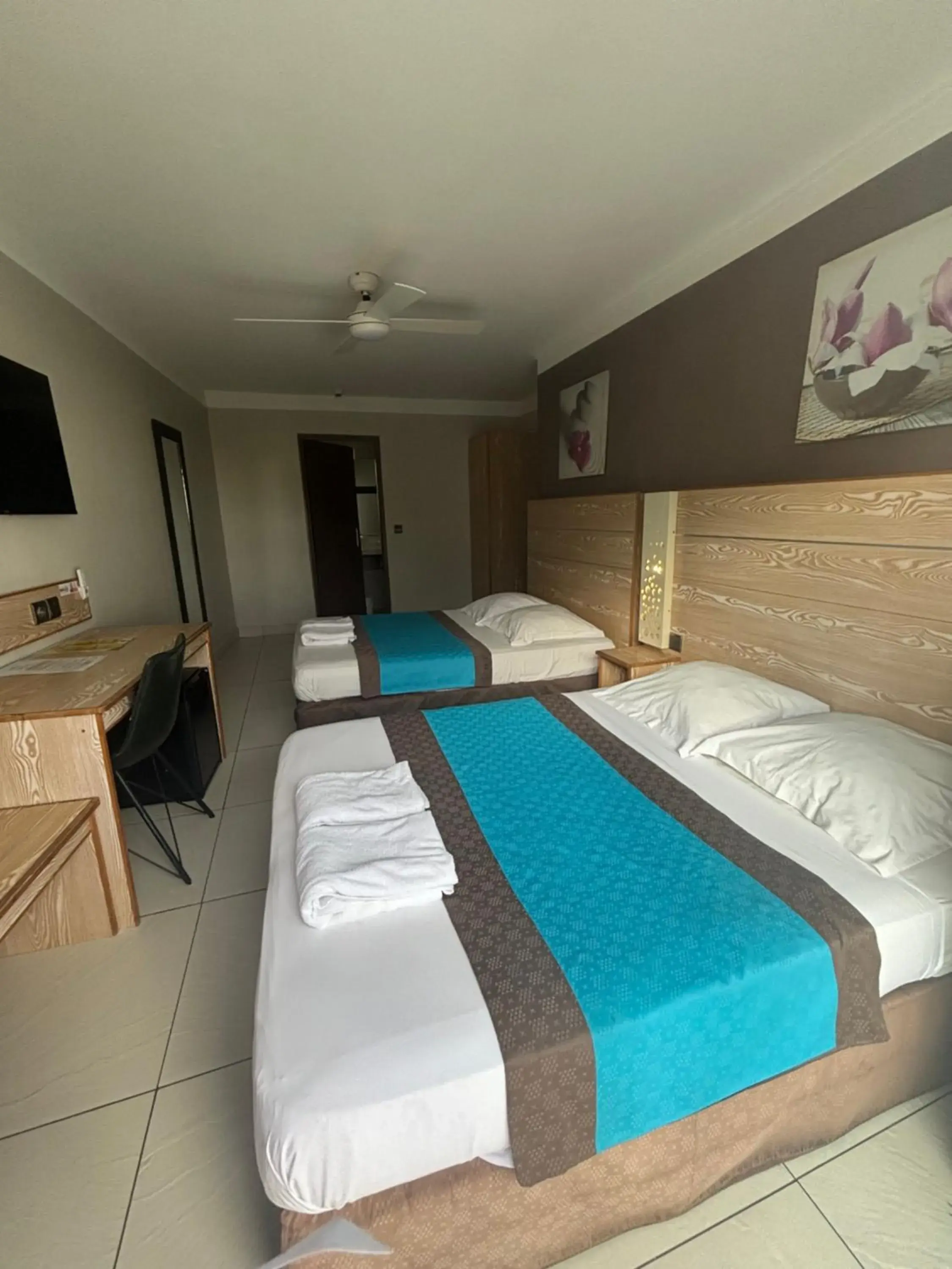 Quadruple Room in Hôtel Select - Réunion Quadruple Room in Hôtel Select - Réunion