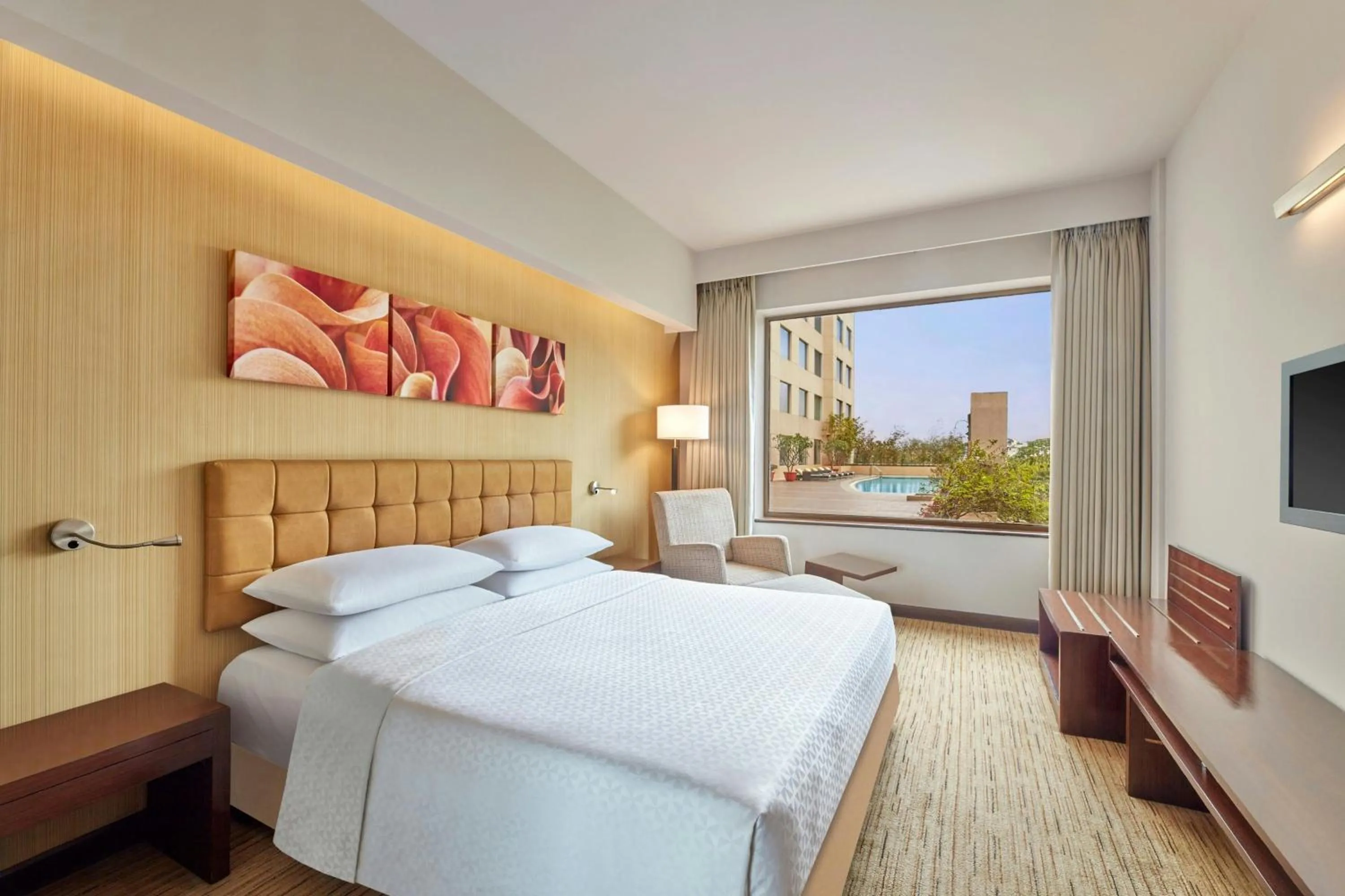 Swimming pool, Bed in Four Points by Sheraton Hotel and Serviced Apartments Pune