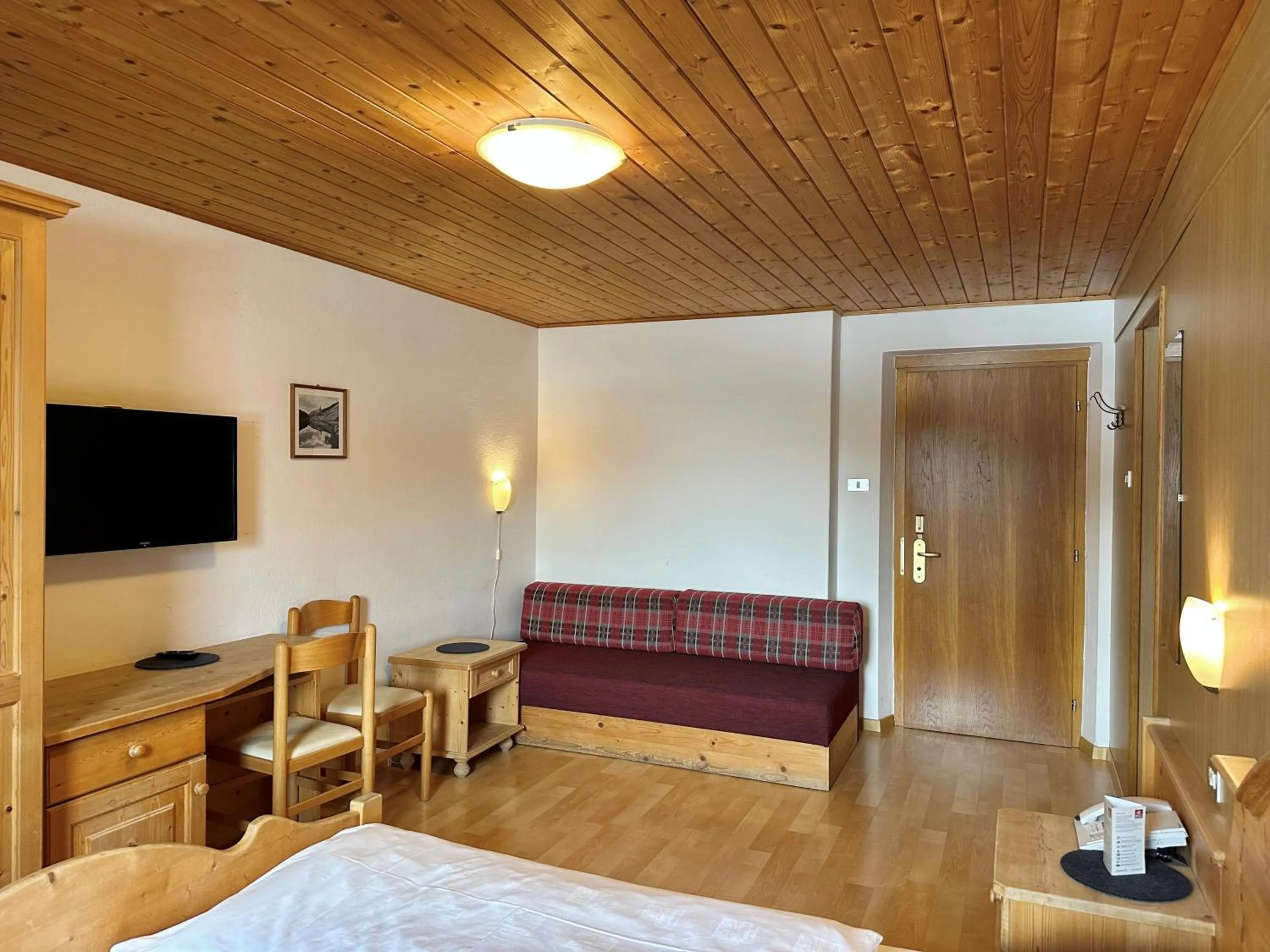 Bed in Apparthotel Germania