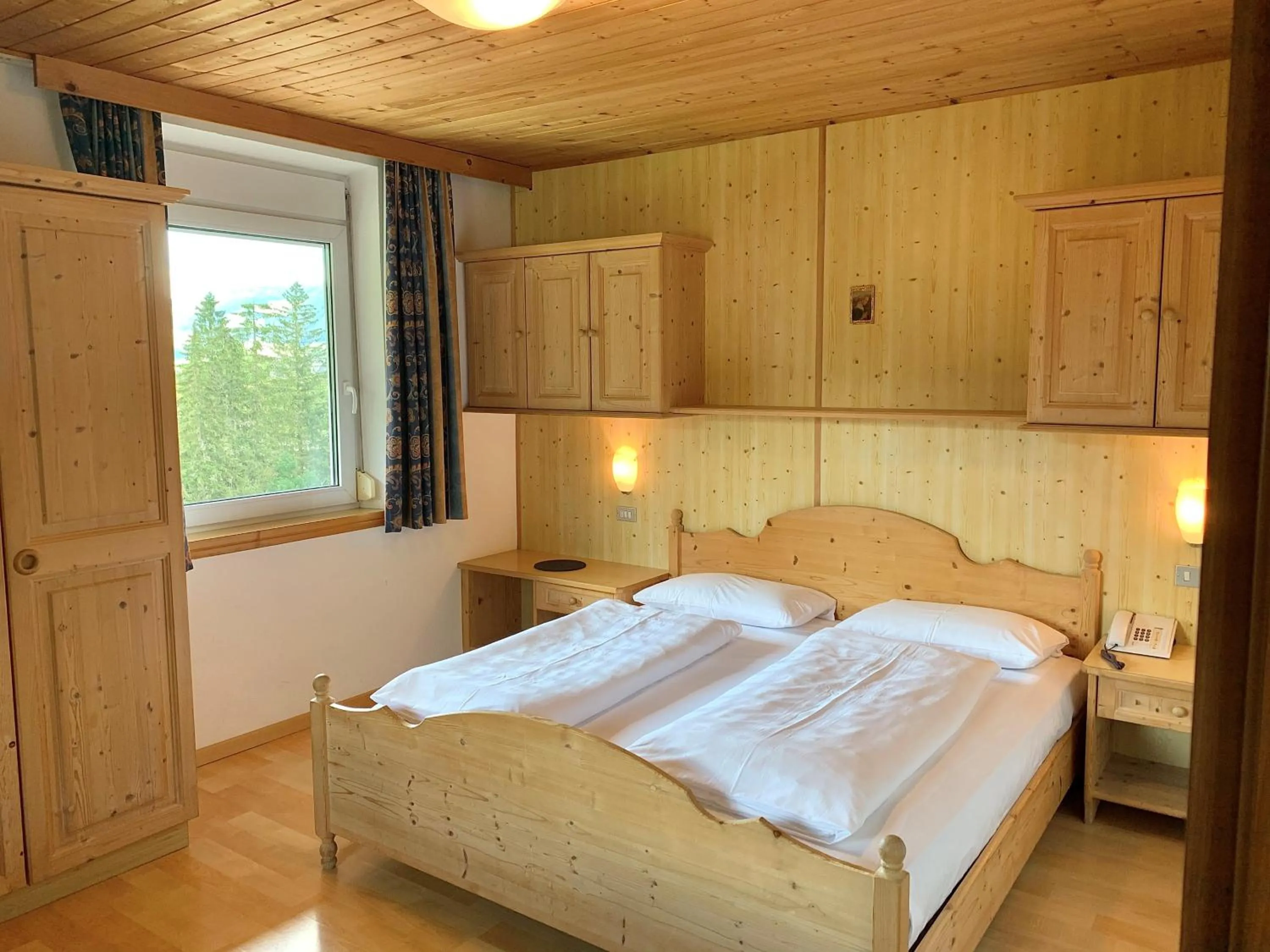 Bed in Apparthotel Germania