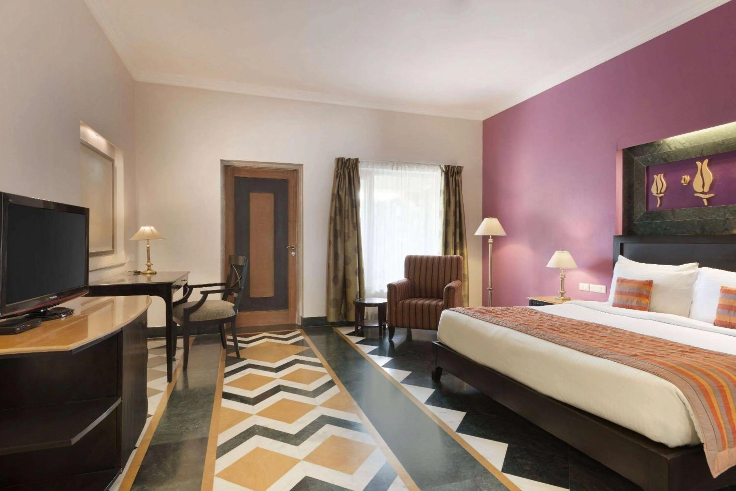 Photo of the whole room, Bed in Ramada by Wyndham Udaipur Resort and Spa