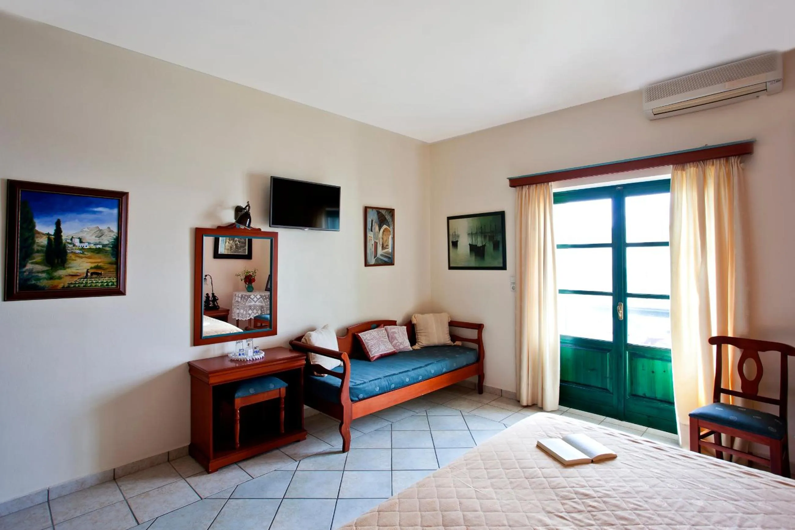 Seating area, Bed in Apollon Hotel