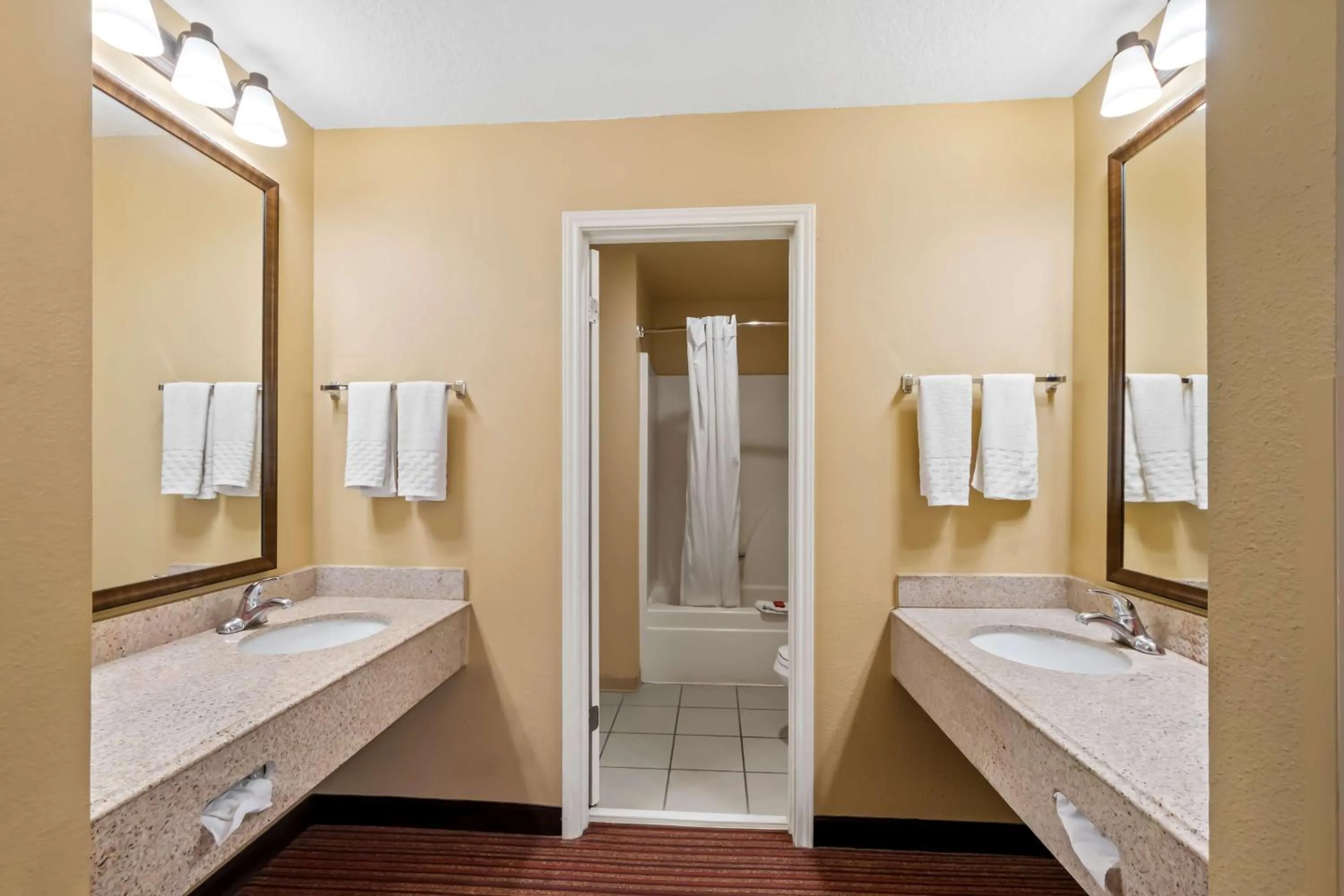Bathroom in SureStay Plus by Best Western San Antonio Fiesta Inn